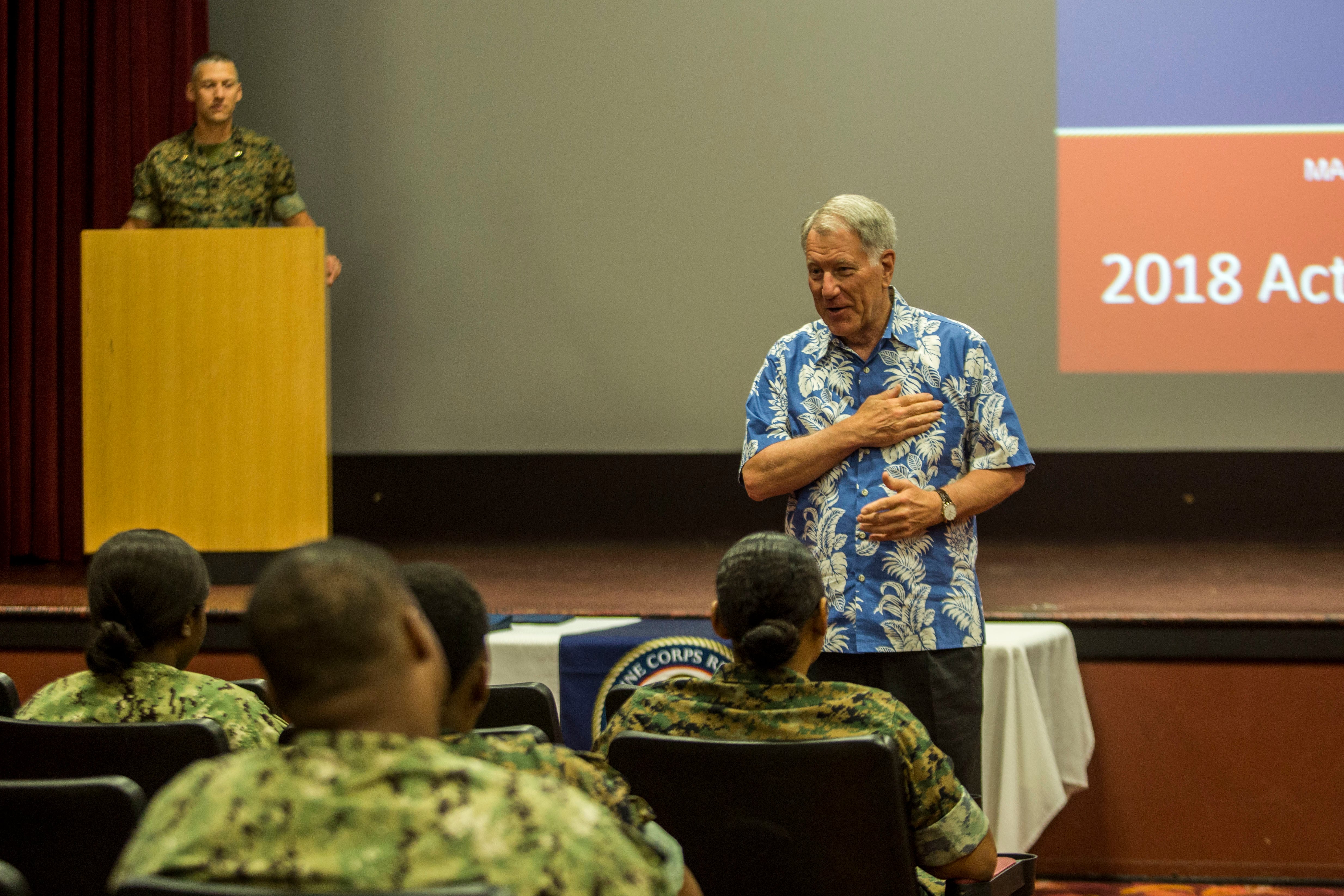 Retired Navy Adm. Steve Abbot, the president of Navy-Marine Corps Relief Society, speaks to service members and families during an Active Duty Fund Drive award ceremony at the base theater at Marine Corps Base Hawaii in 2018.