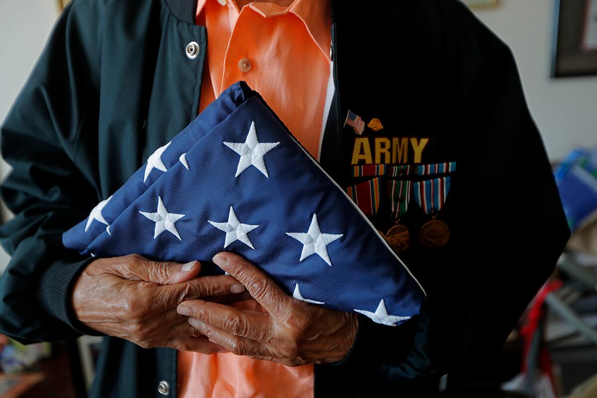 World War II veteran Johnnie Jones Sr. poses for a portrait at his home in Baton Rouge, La.