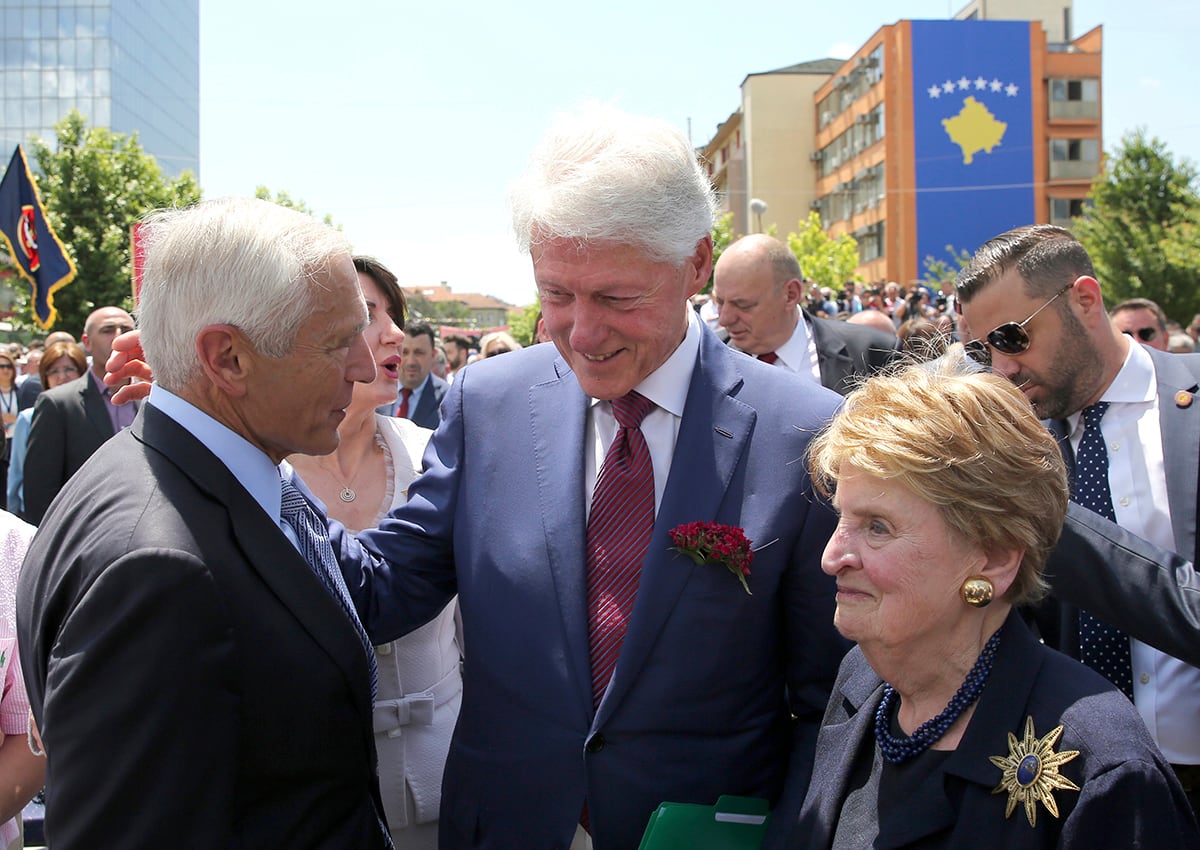 Former U.S. President Bill Clinton, center, speaks with ex-Secretary of State Madeleine Albright, right, and then-NATO commander Wesley Clark during anniversary celebrations in the capital Pristina, Kosovo, Wednesday, June 12, 2019.