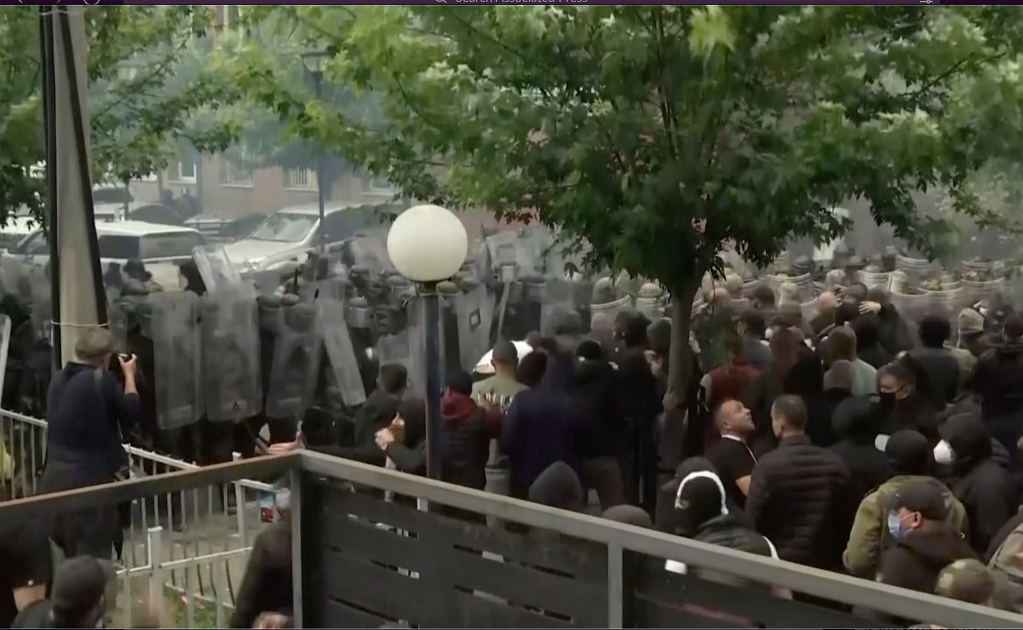 In this grab taken from video, KFOR soldiers guard a municipal building after clashes with Kosovo Serbs in the town of Zvecan, northern Kosovo, Monday, May 29, 2023.