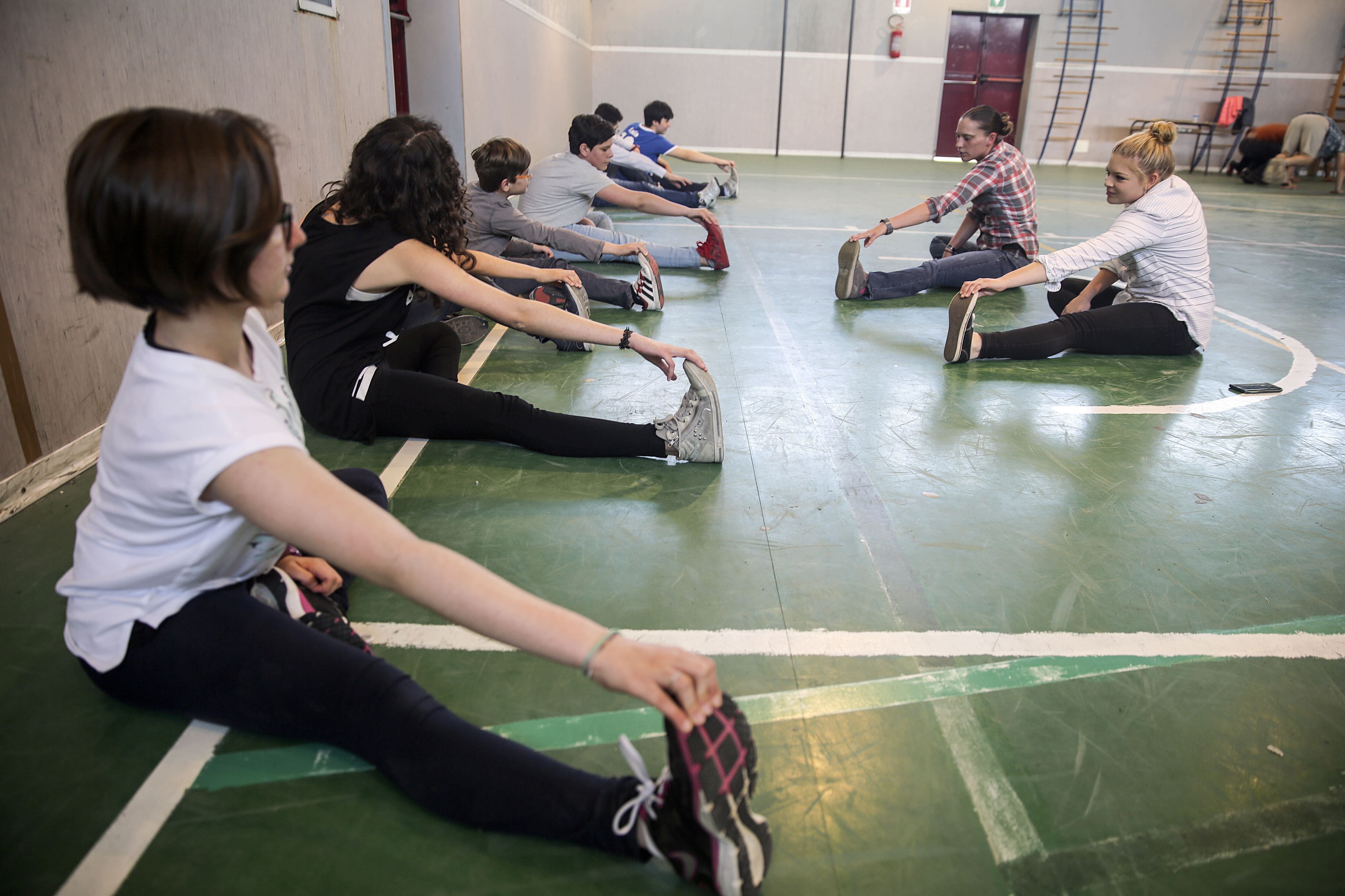 Marines conduct cool-down stretches with students at Instituto Comprensivo “Salvo Basso” Scordia, Italy on May 5, 2016.