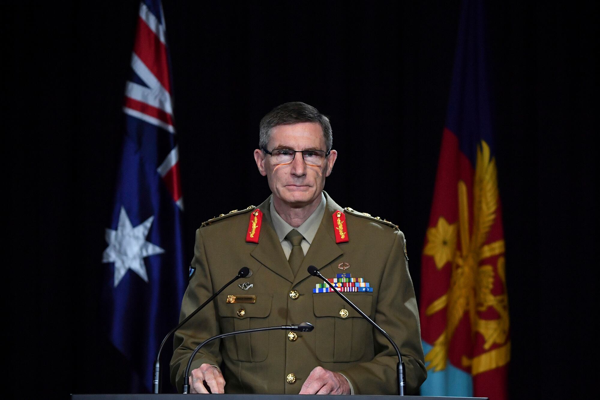 Chief of the Australian Defence Force Gen. Angus Campbell delivers the findings from the Inspector-General of the Australian Defence Force Afghanistan Inquiry, in Canberra, Thursday, Nov. 19, 2020.