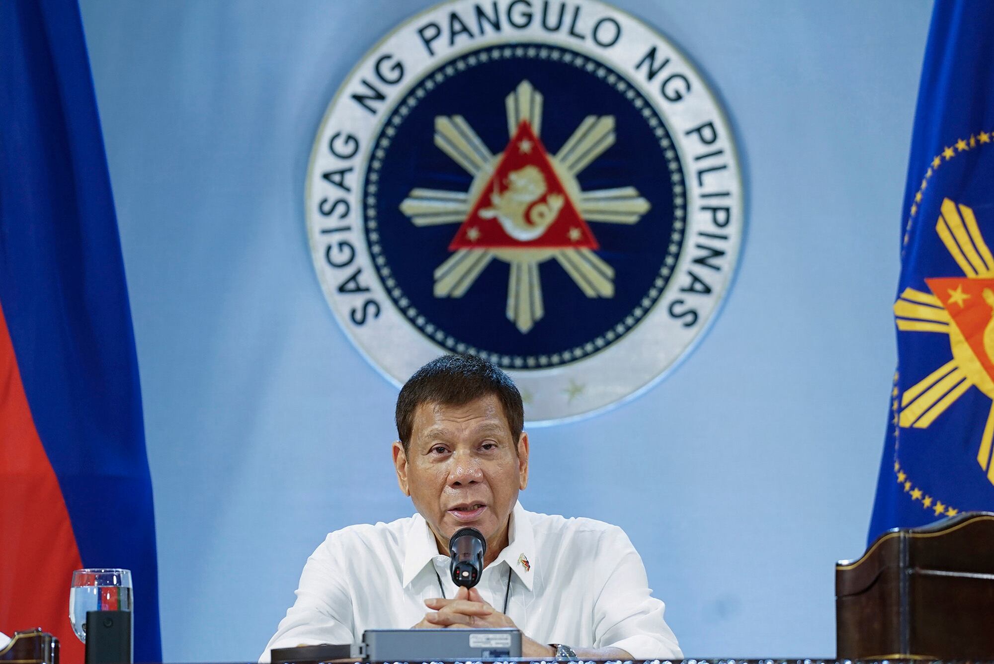 Philippine President Rodrigo Duterte gestures as he meets members of the Inter-Agency Task Force on the Emerging Infectious Diseases at the Malacanang presidential palace in Manila, Philippines on Monday, Dec. 7, 2020.