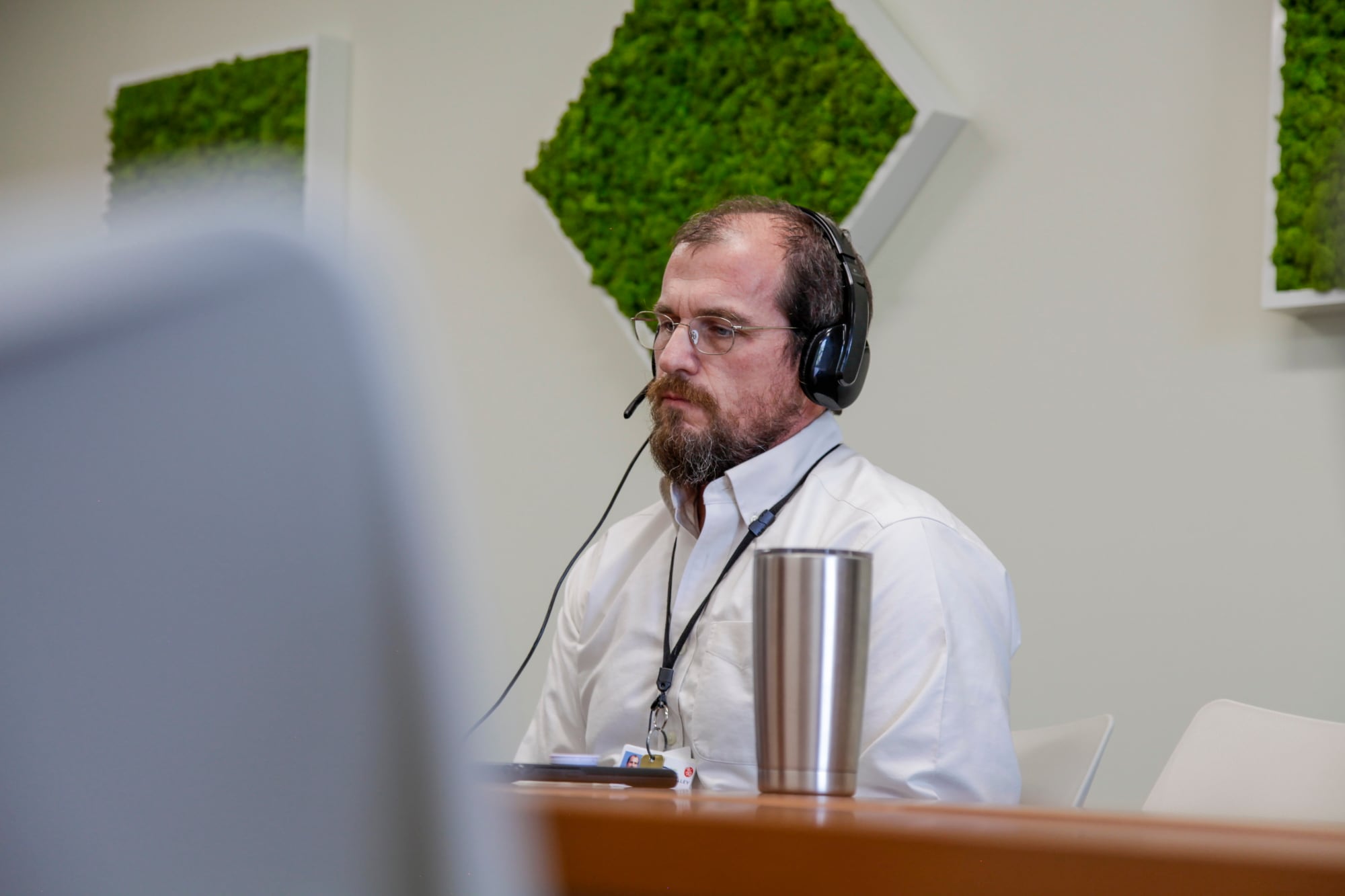 Lead Clinician Matt Turner speaks to potential clients about the mental health services offered at Cohen Veteran’s Network’s Fayetteville clinic via video conference on Wednesday, April 22, 2020 in Fayetteville, N.C.