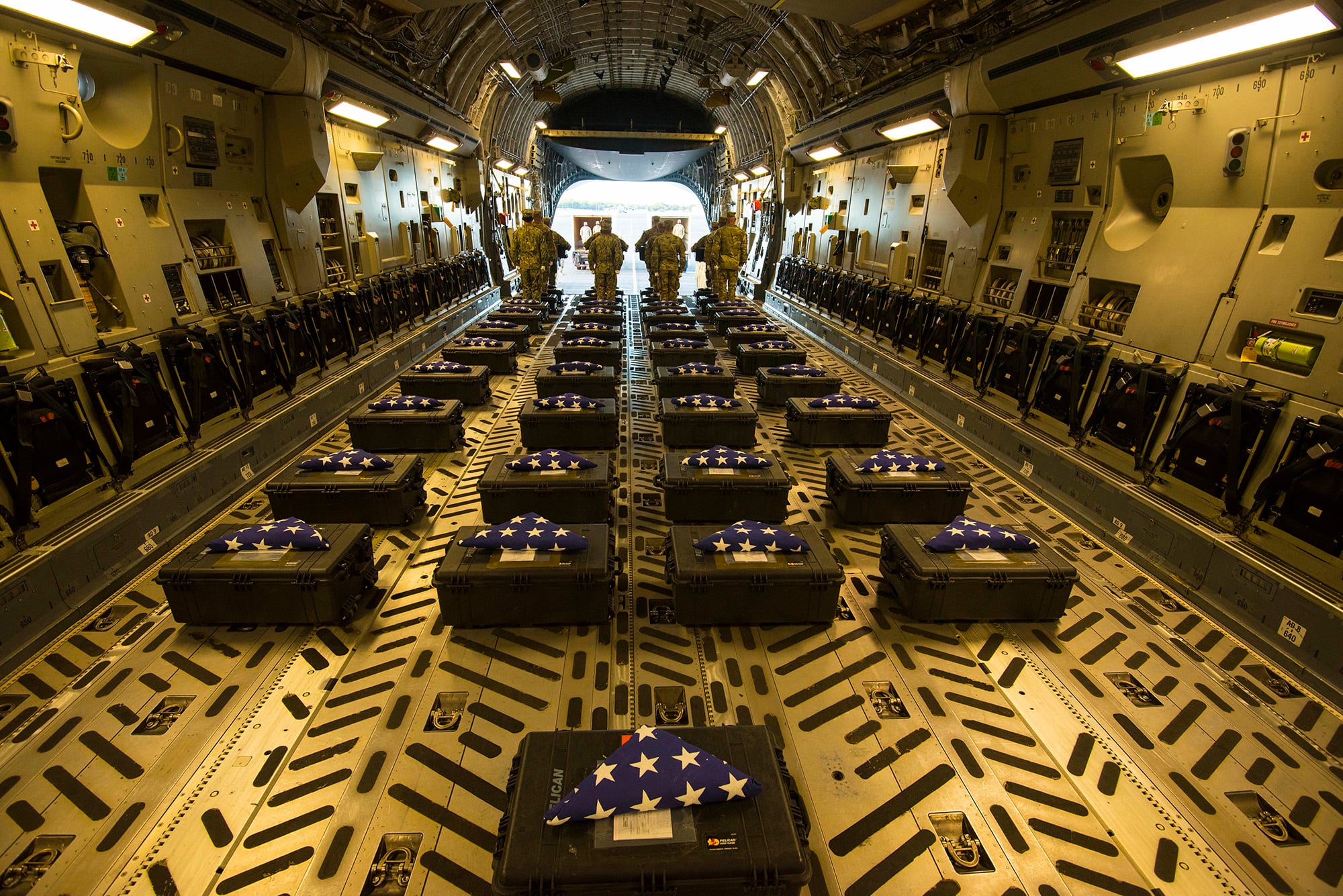 Members of the Defense POW/MIA Accounting Agency (DPAA) conduct an honorable carry for the remains of unidentified U.S. service members at Joint Base Pearl Harbor-Hickam, Hawaii, Dec. 21, 2020. The remains were recently disinterred from graves at the Manila American Cemetery and Memorial in the Philippines as part of DPAA’s effort to provide the fullest possible accounting of our missing personnel to their families and the nation.