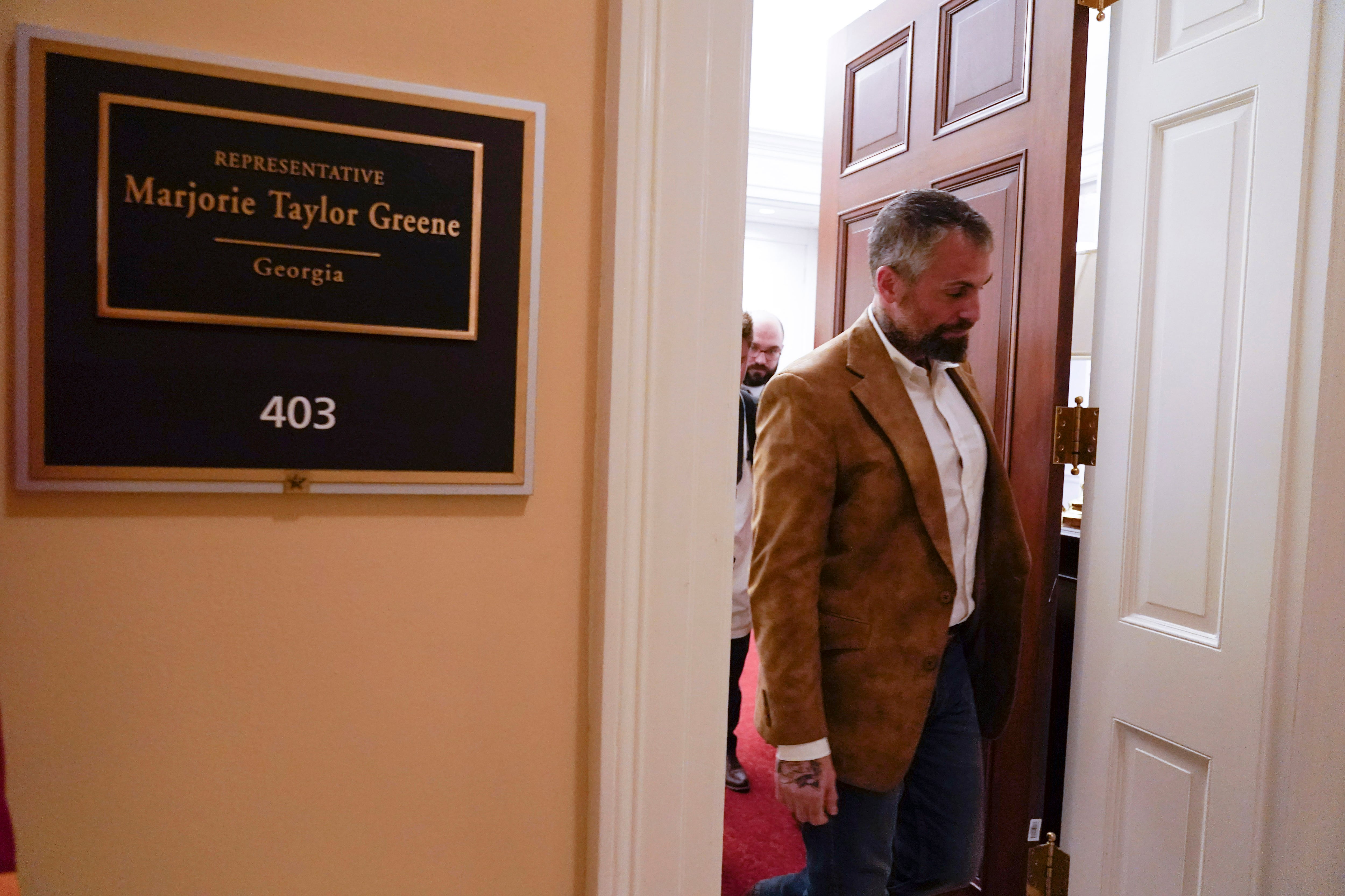 Former Washington Metropolitan Police Department officer Michael Fanone leaves Rep. Marjorie Taylor Greene's office after hand delivering a letter as the House meets for a second day to elect a speaker and convene the 118th Congress in Washington, Wednesday, Jan. 4, 2023.