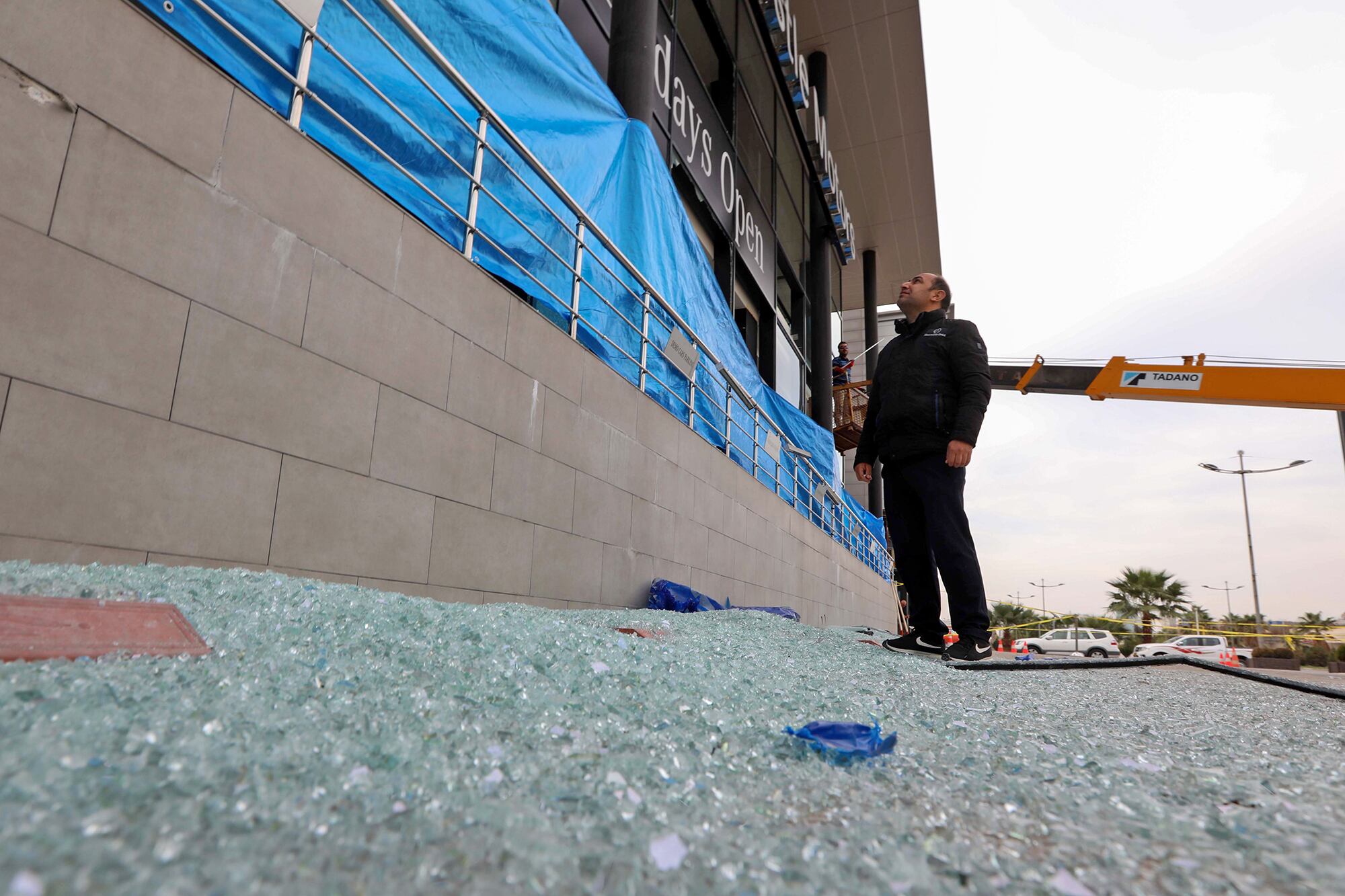 A man inspects the damage on Feb. 16, 2021, following a rocket attack the previous night in Irbil, the capital of the northern Iraqi Kurdish autonomous region.