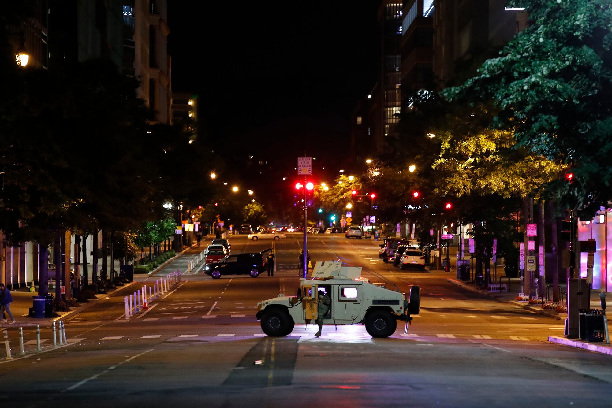 A military Humvee blocks an intersection along K Street in downtown Washington as demonstrators protest the death of George Floyd, Monday, June 1, 2020, in Washington.