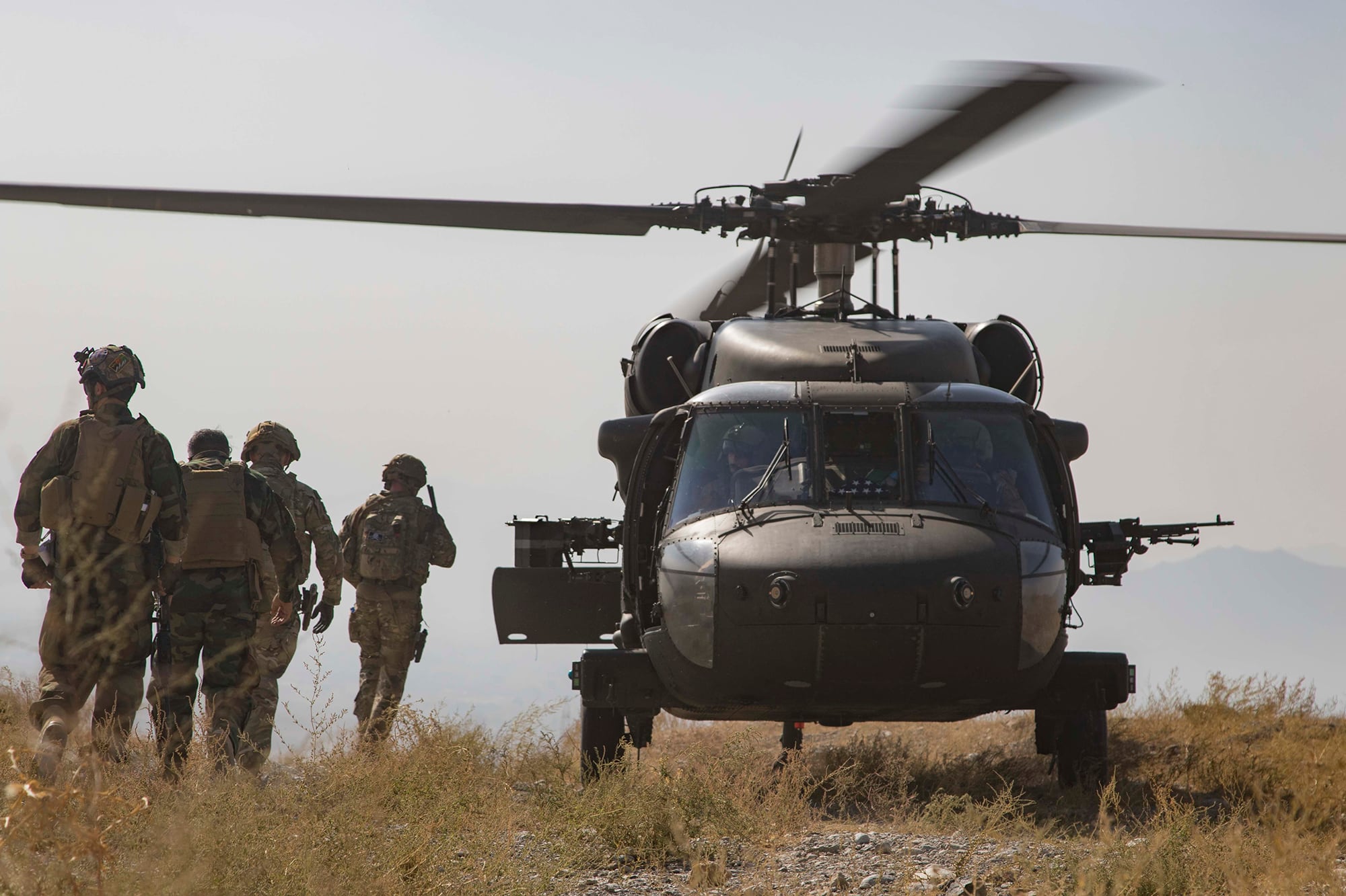 Afghan National Army soldiers and coalition advisers assigned prepare to board a UH-60 Black Hawk helicopter following the completion of a key stage of an Afghan-led and executed clearance operation to safeguard Afghan civilians in southeastern Afghanistan, Sept 25, 2019.