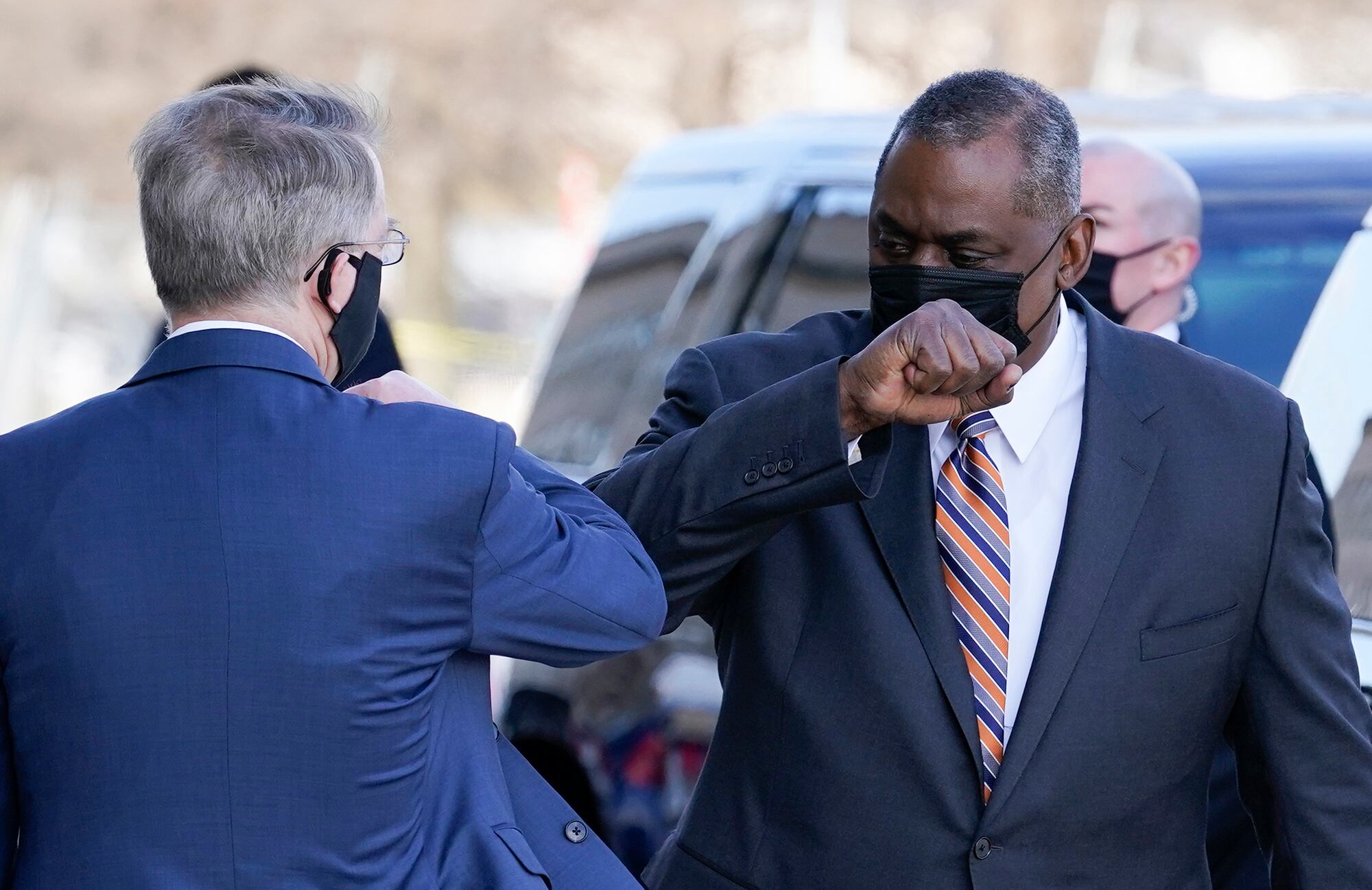 Defense Secretary Lloyd Austin, right, greets Deputy Secretary of Defense David Norquist as he arrives at the Pentagon on Jan. 22, 2021, in Washington.