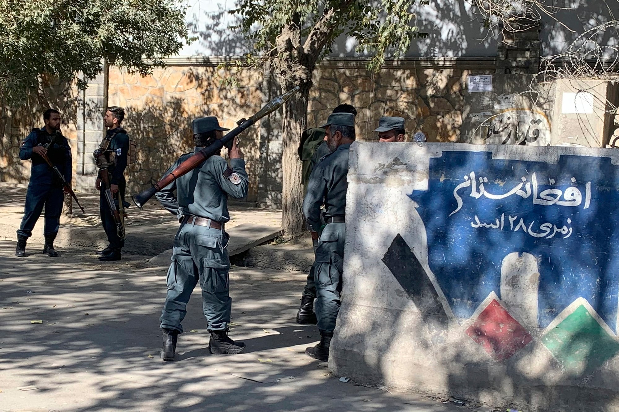 Afghan police arrive at the site of an attack at Kabul University in Kabul, Afghanistan, Monday, Nov. 2, 2020.