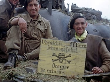 Soldiers sit on a tank