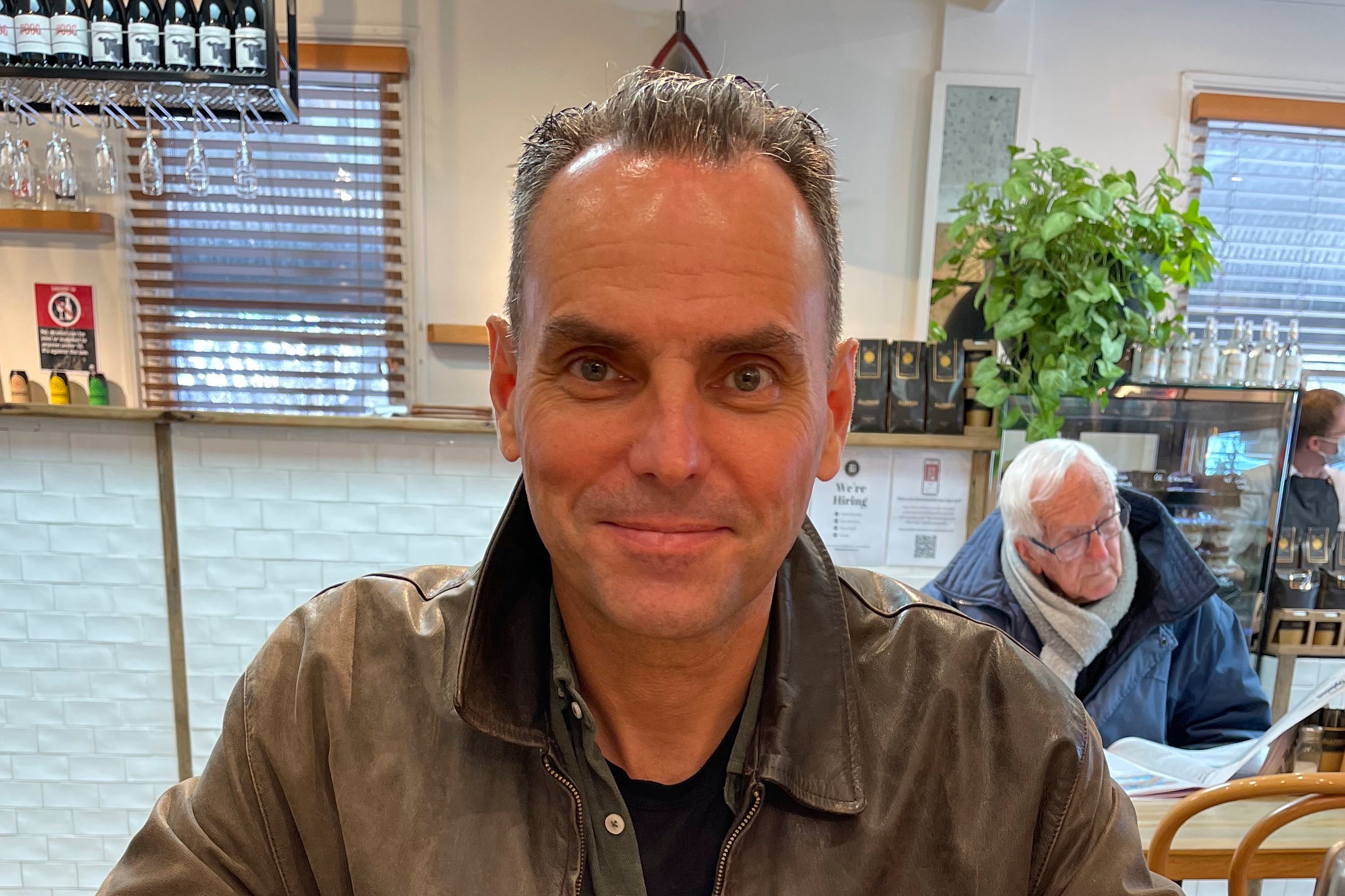 In this undated photo provided by Saffrine Duggan, her husband Daniel Duggan poses for a photo in a restaurant.