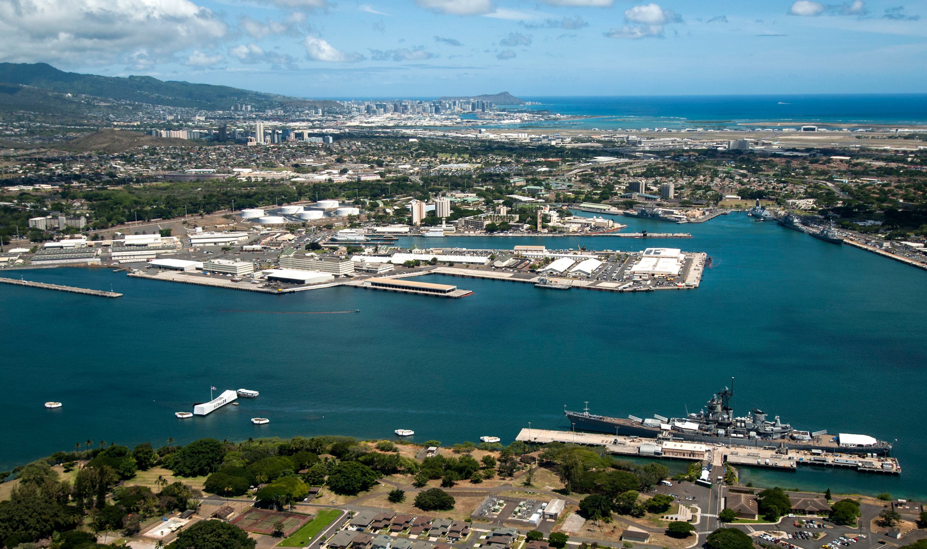 An aerial view of the USS Arizona and USS Missouri Memorials at Ford Island, Joint Base Pearl Harbor-Hickam on Aug. 6, 2013.