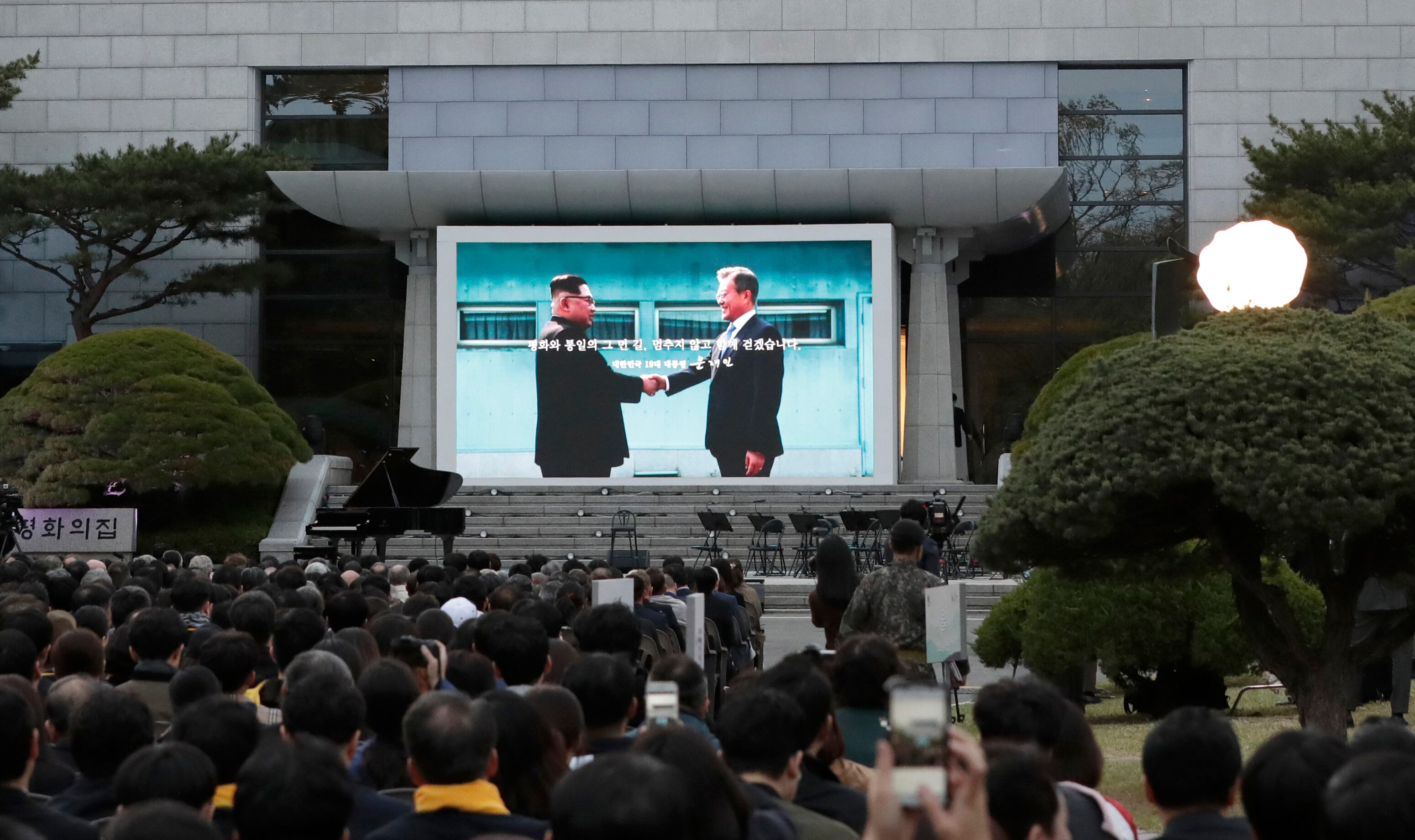 South Korean President Moon Jae-in, right, and North Korean leader Kim Jong Un