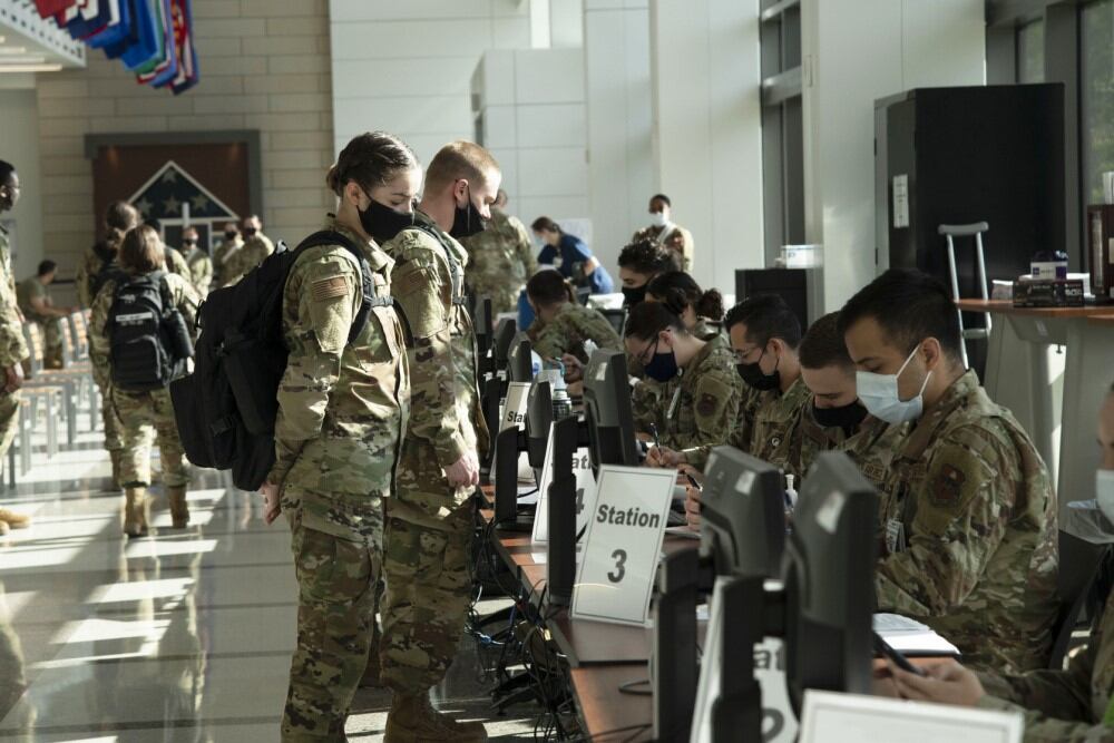 A U.S. Air Force basic trainee from the 737th Training Group provides information at the processing line to receive a COVID-19 vaccine at Wilford Hall Ambulatory Surgical Center, May 14, 2021. (Tech. Sgt. Tory Patterson/Air Force)