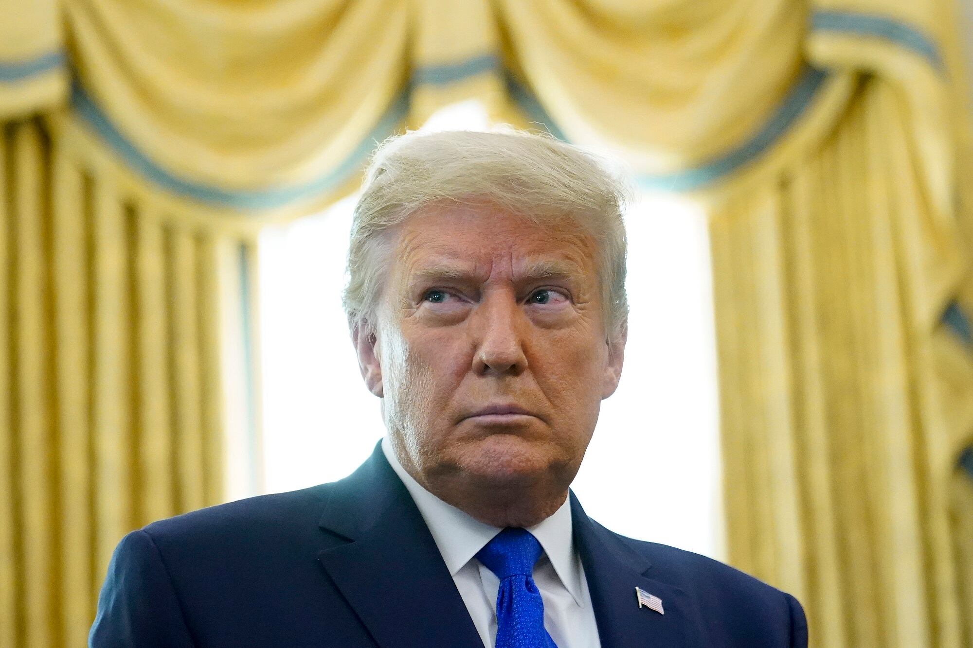 In this Dec. 7, 2020, photo,President Donald Trump in the Oval Office of the White House in Washington.