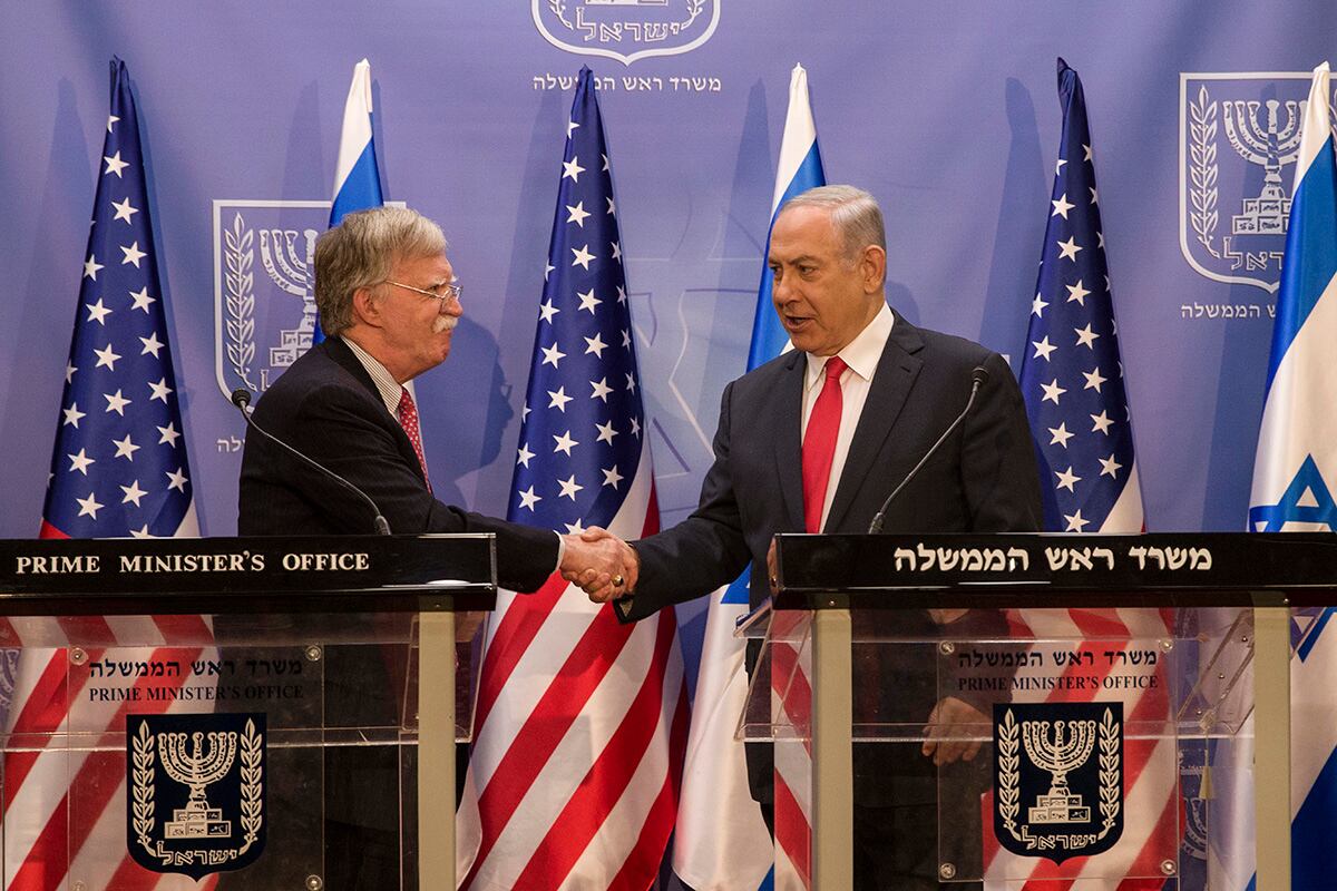 Israeli Prime Minister Benjamin Netanyahu, right, shakes hands with U.S. National Security Adviser John Bolton in Jerusalem