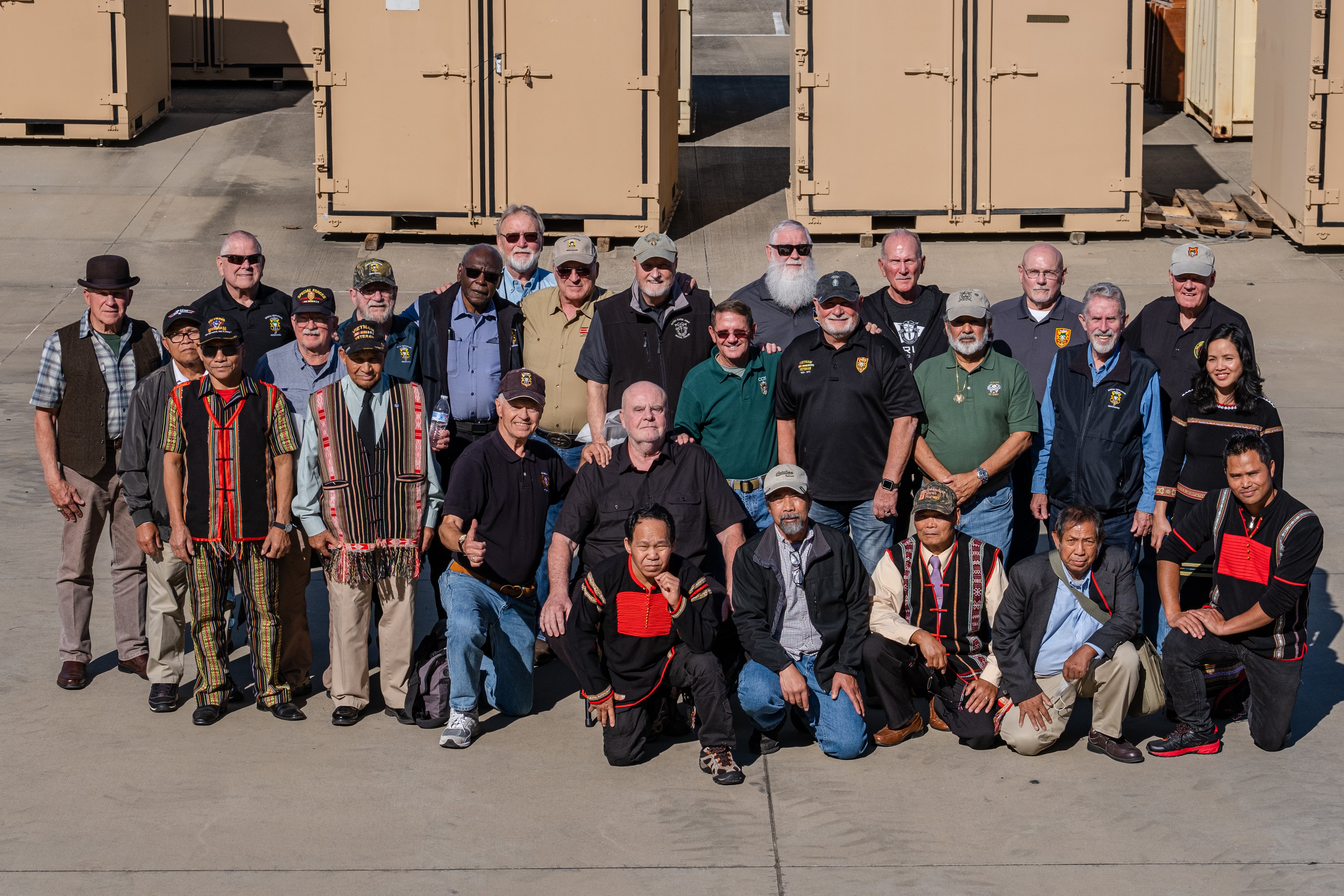 Military Assistance Command, Vietnam-Studies and Observations Group, or MACV-SOG, veterans and Vietnamese Montgard pose together during MACV-SOG heritage week, Fort Bragg N.C., Nov. 10, 2021.