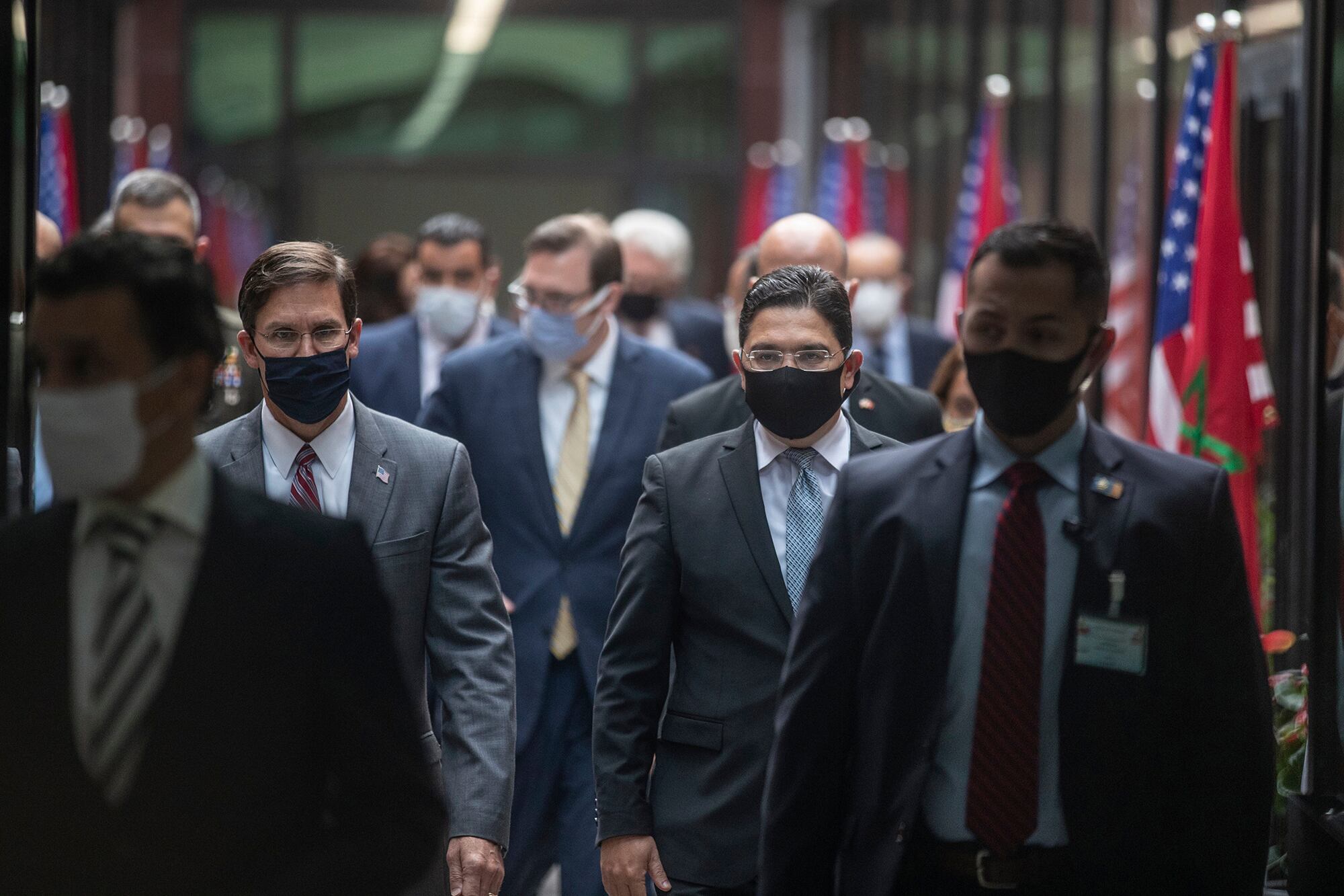 U.S. Secretary of Defense Mark Esper, left, and Moroccan Foreign Minister Nasser Bourita, right, walk together during Eper's visit to Rabat, Morocco, Friday, Oct. 2, 2020.