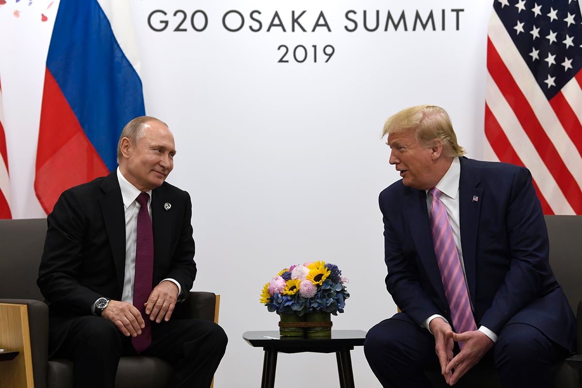 In this June 28, 2019, file photo, President Donald Trump, right, meets with Russian President Vladimir Putin during a bilateral meeting on the sidelines of the G-20 summit in Osaka, Japan.