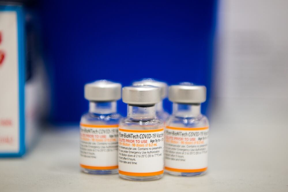 Vials of the Pfizer-BioNTech COVID-19 vaccine sit on a table before being administered at Kadena Air Base, Japan, Jan. 28, 2022. (Airman 1st Class Anna Nolte/Air Force)