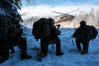 An Alaska Army National Guard UH-60L Black Hawk helicopter lands to pick up Air Force special warfare airmen during small-unit training at Joint Base Elmendorf-Richardson, Alaska, Nov. 18, 2020.