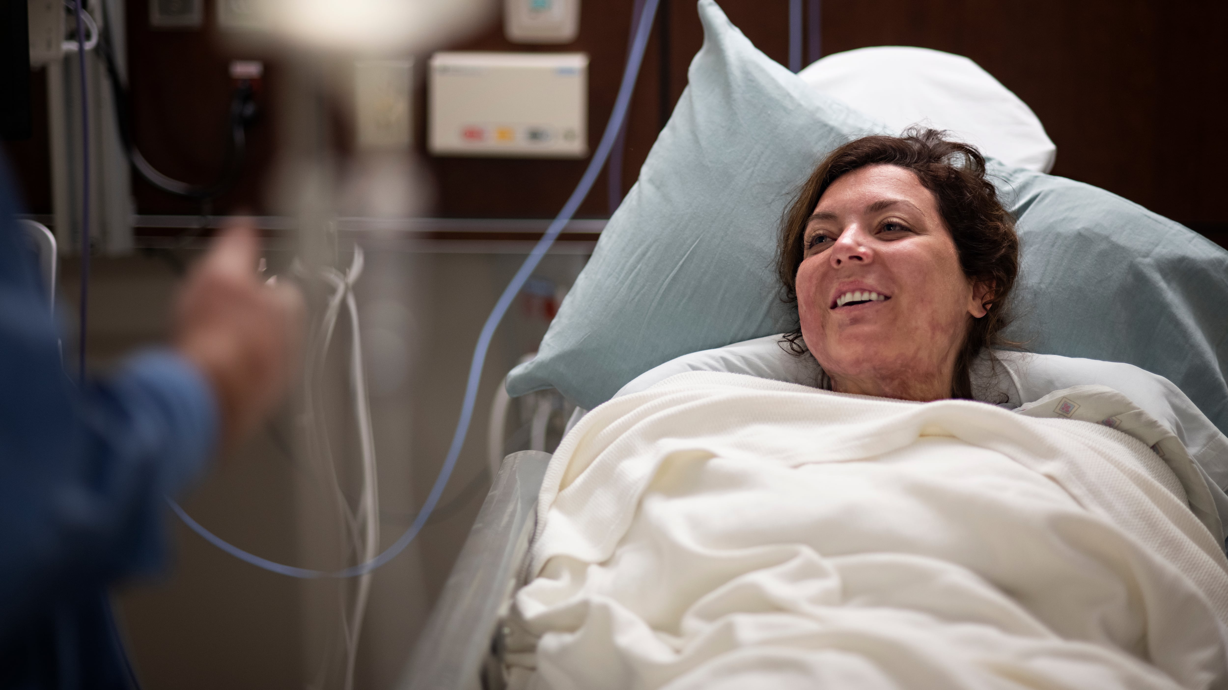 Retired U.S. Army Capt. Katie Blanchard speaks with a nurse before surgery Sept. 6, 2019 at Wilford Hall Ambulatory Surgical Center, Joint Base San Antonio-Lackland, Texas.