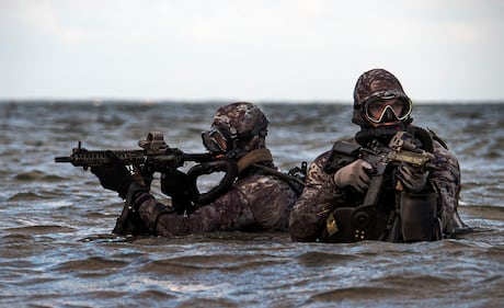 Sailors assigned to Naval Special Warfare Group 2 conduct military dive operations off the East Coast