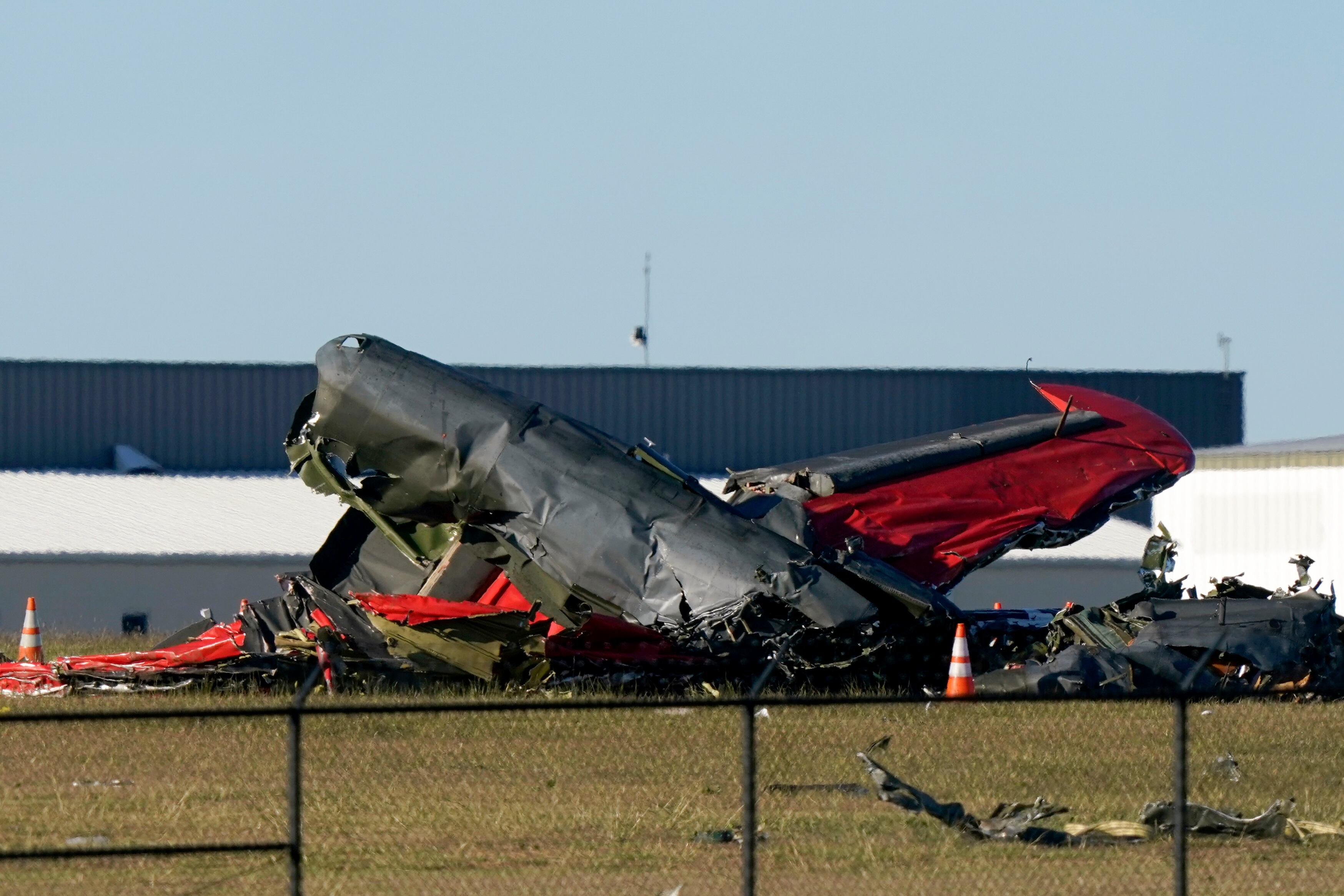 Debris from two planes that crashed during an airshow at Dallas Executive Airport are shown in Dallas on Saturday, Nov. 12, 2022.