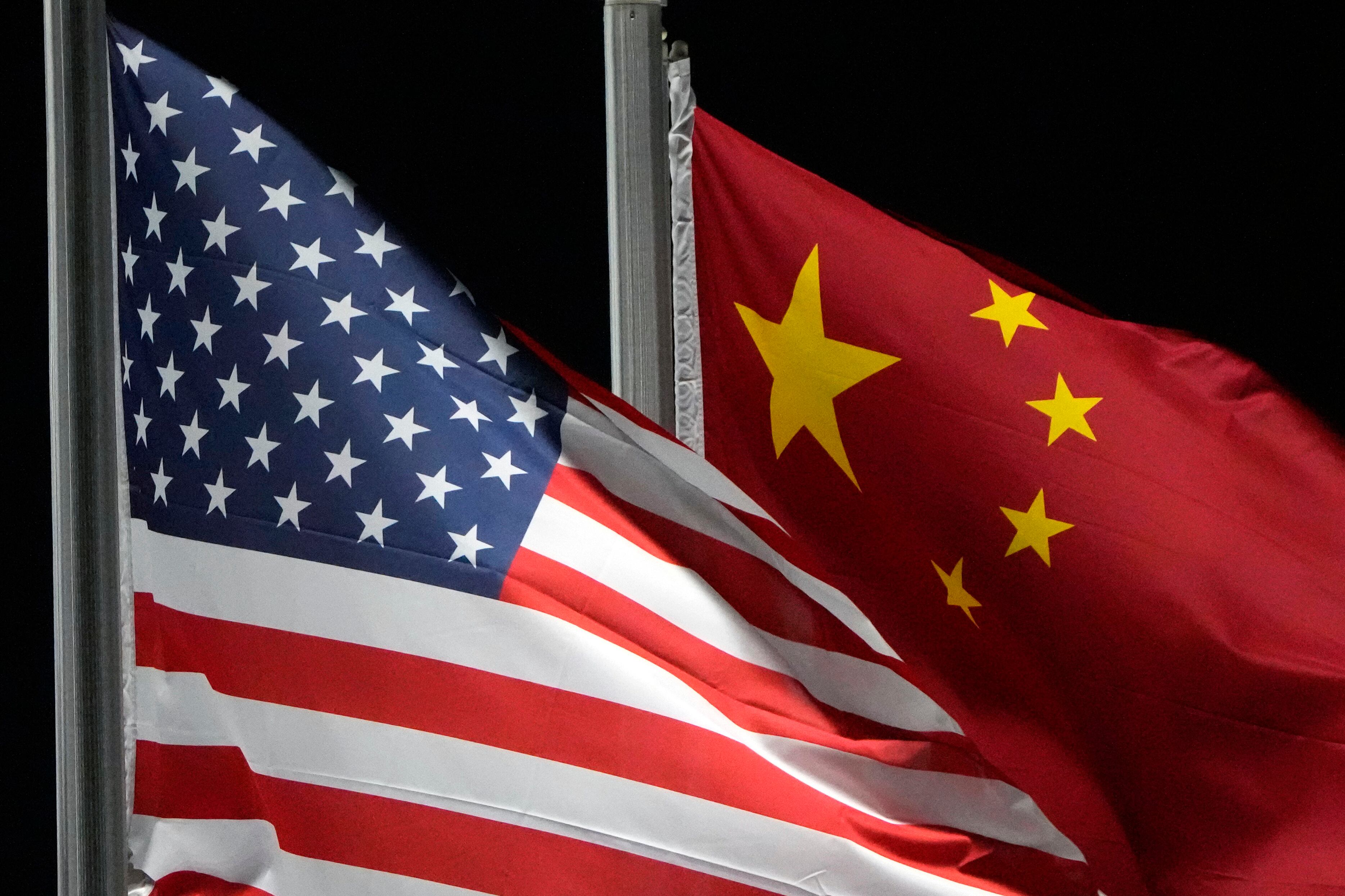 The American and Chinese flags wave at Genting Snow Park ahead of the 2022 Winter Olympics, Feb. 2, 2022, in Zhangjiakou, China.