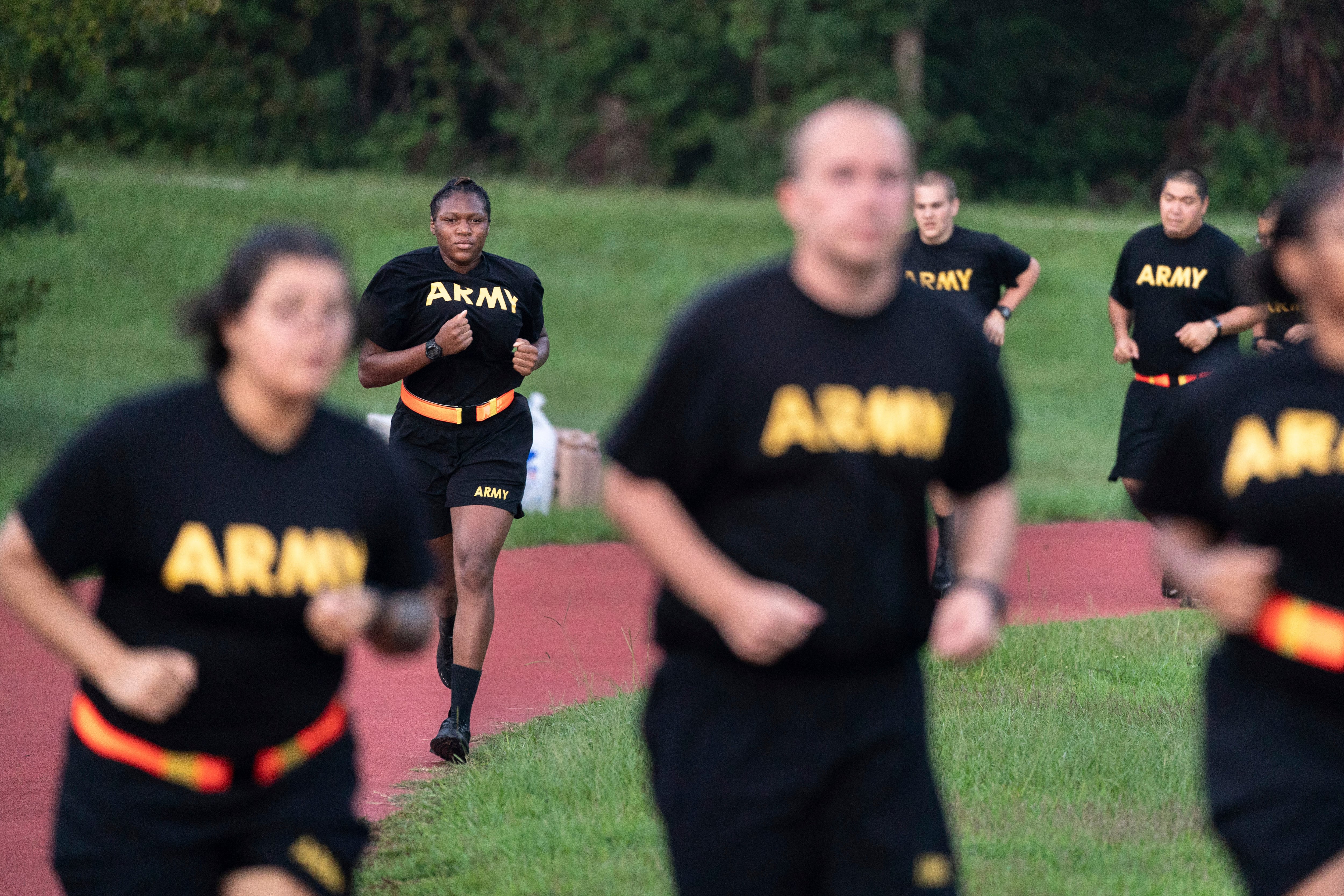 Students in the new Army prep course run around a track during physical training exercises at Fort Jackson in Columbia, S.C., Aug. 27, 2022.