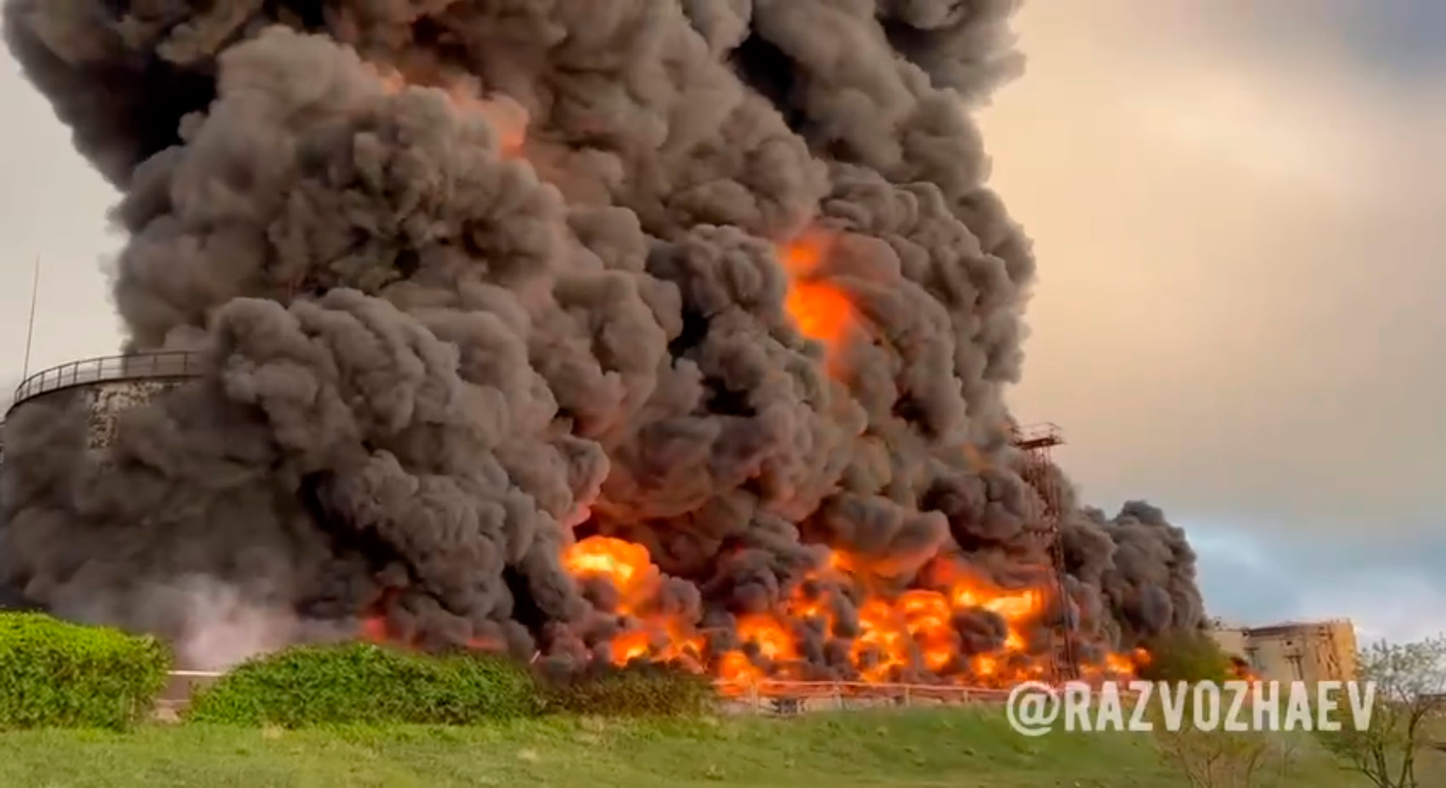 In this handout photo taken from video released by the Governor of Sevastopol Mikhail Razvozhaev telegram channel on Saturday, April 29, 2023, smoke and flame rise from a burning fuel tank in Sevastopol, Crimea.