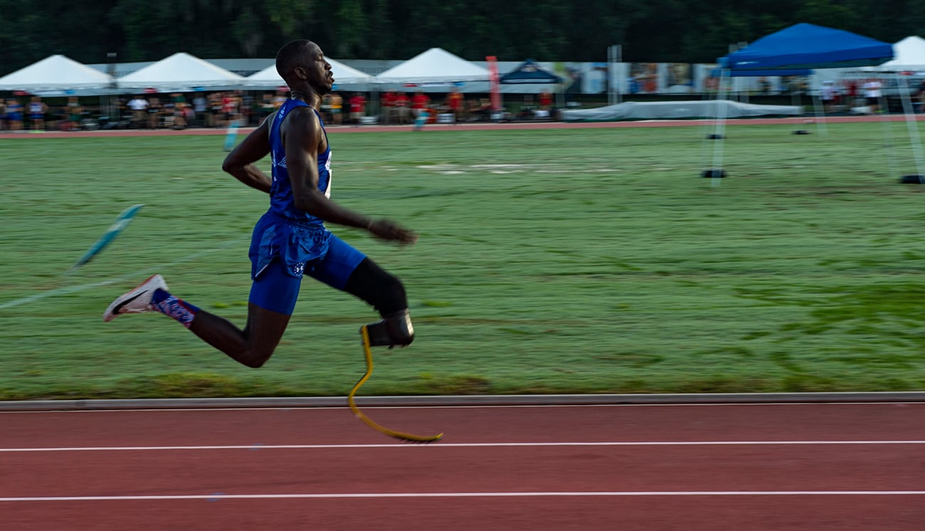 Air Force Staff Sgt. Kevin Greene, Team Air Force athlete, competes in the 200-meter dash during the Department of Defense Warrior Games track competition in Tampa, Fla., June 22, 2019.