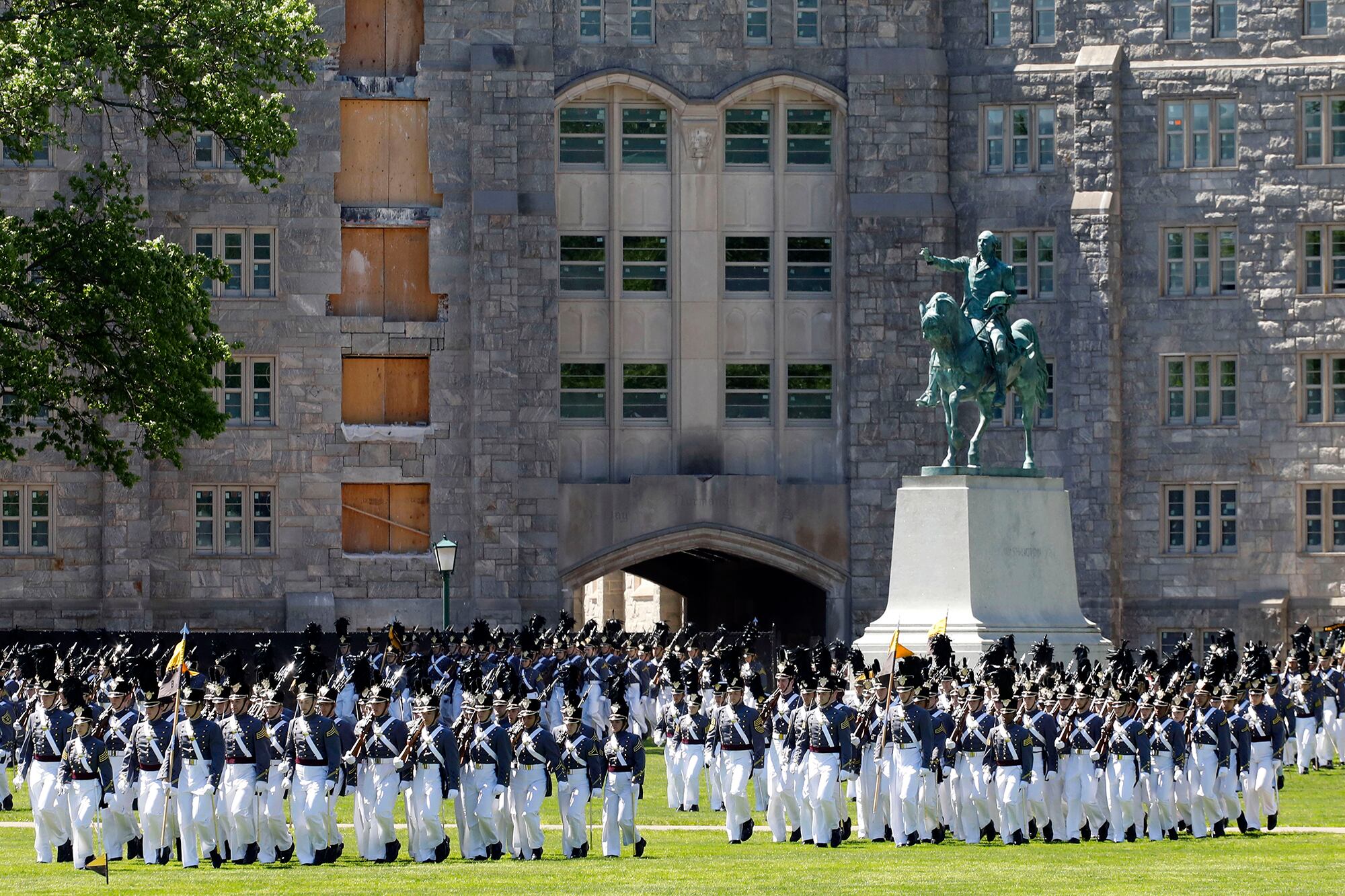 In this May 22, 2019, file photo, members of the senior class march past a statue of George Washington during Parade Day at the U.S. Military Academy in West Point, N.Y.