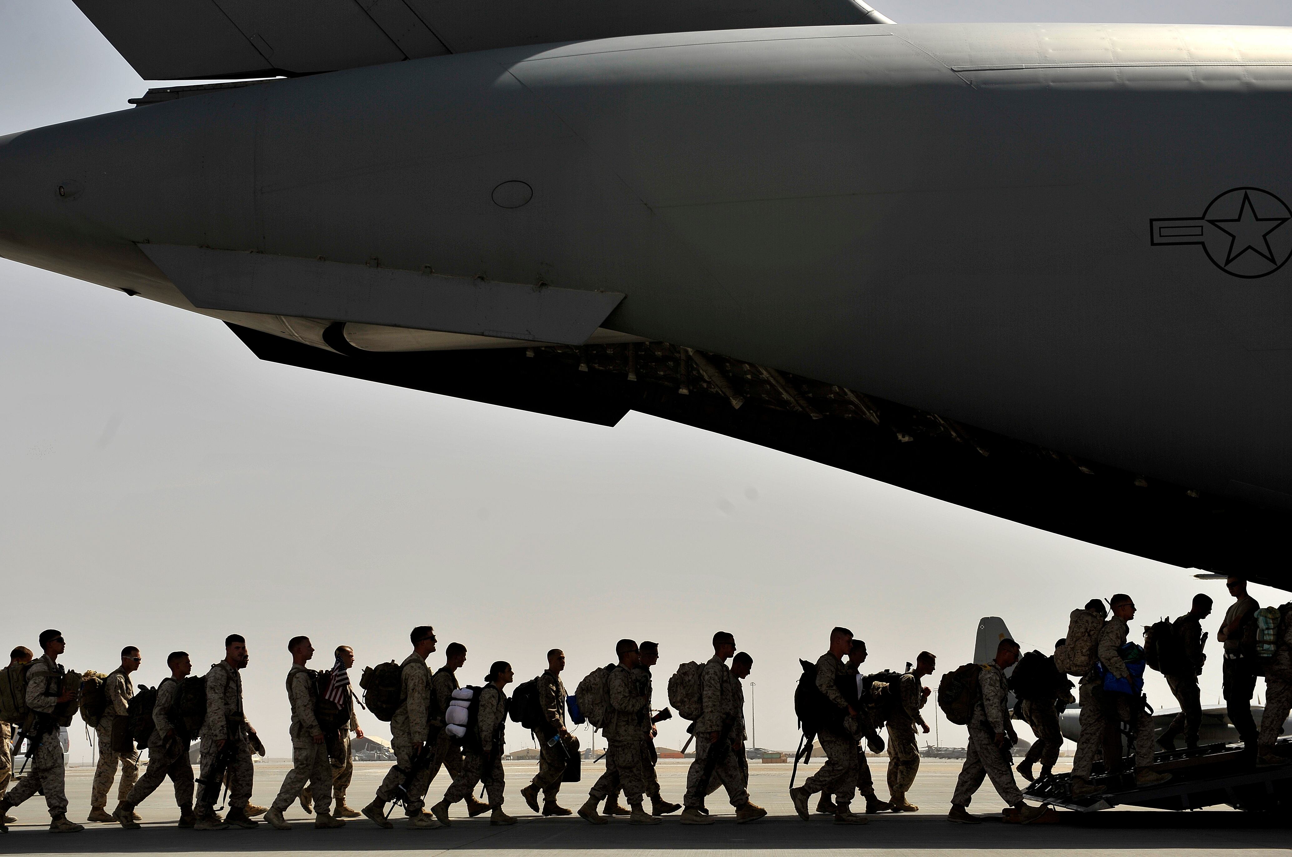 Marines board an Air Force C-17 Globemaster III during a redeployment mission at Camp Bastion Airfield, Afghanistan, Sept. 11, 2012.