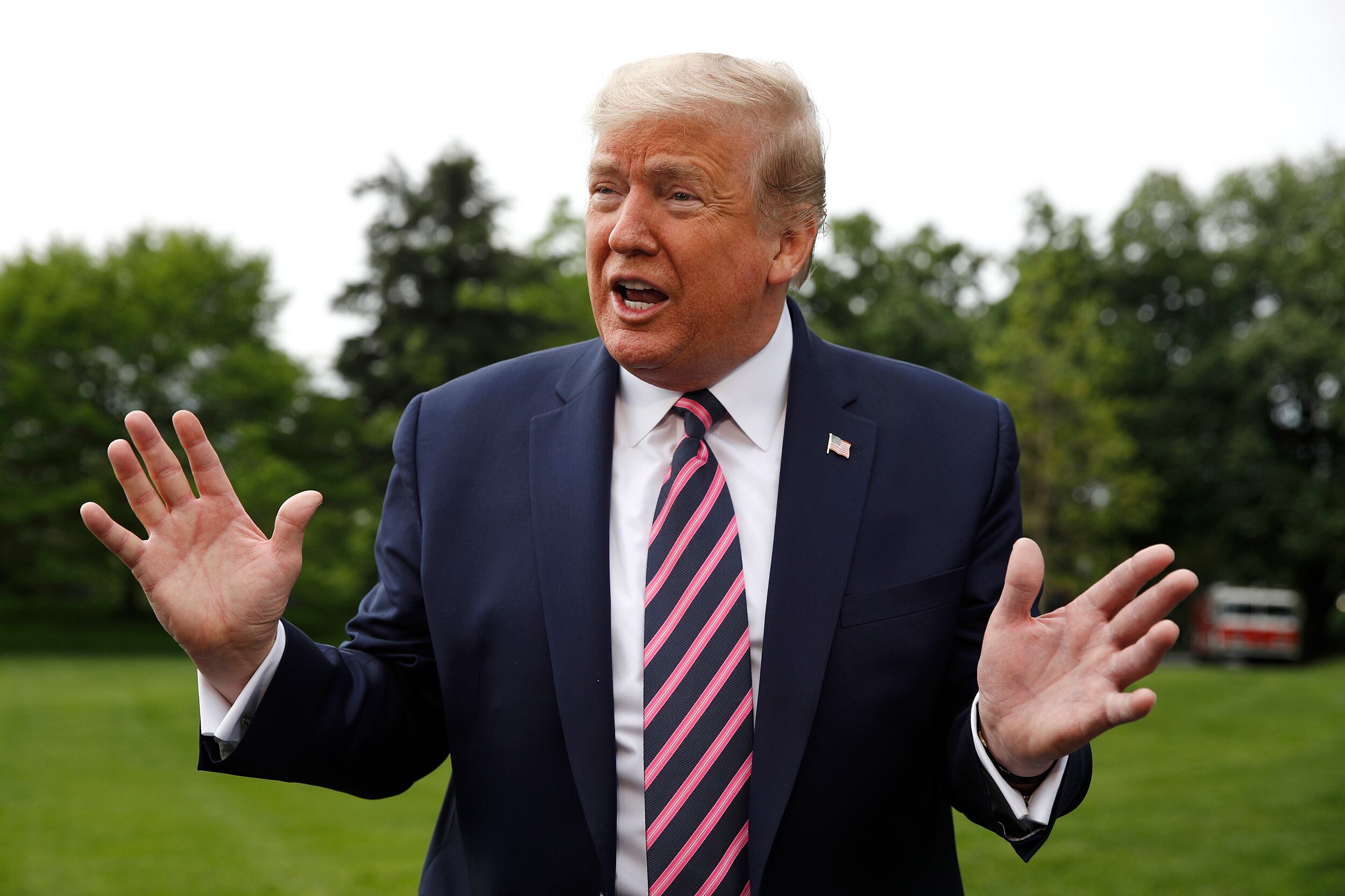 President Donald Trump speaks to members of the media on the South Lawn of the White House in Washington, Tuesday, May 5, 2020, before boarding Marine One for a short trip to Andrews Air Force Base, Md., and then on to Phoenix, Ariz.