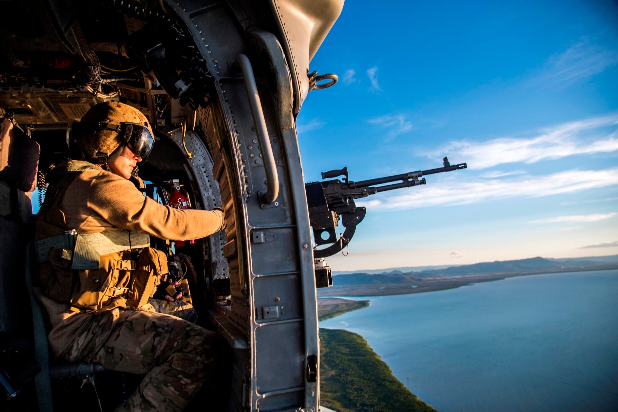 A crew chief scans the skies while on a mission to emplace U.S. and Australian special operations forces during Talisman Sabre, July 12, 2019, in Queensland, Australia.