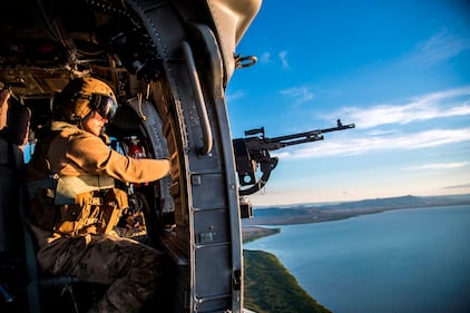 A crew chief scans the skies while on a mission to emplace U.S. and Australian special operations forces during Talisman Sabre, July 12, 2019, in Queensland, Australia.