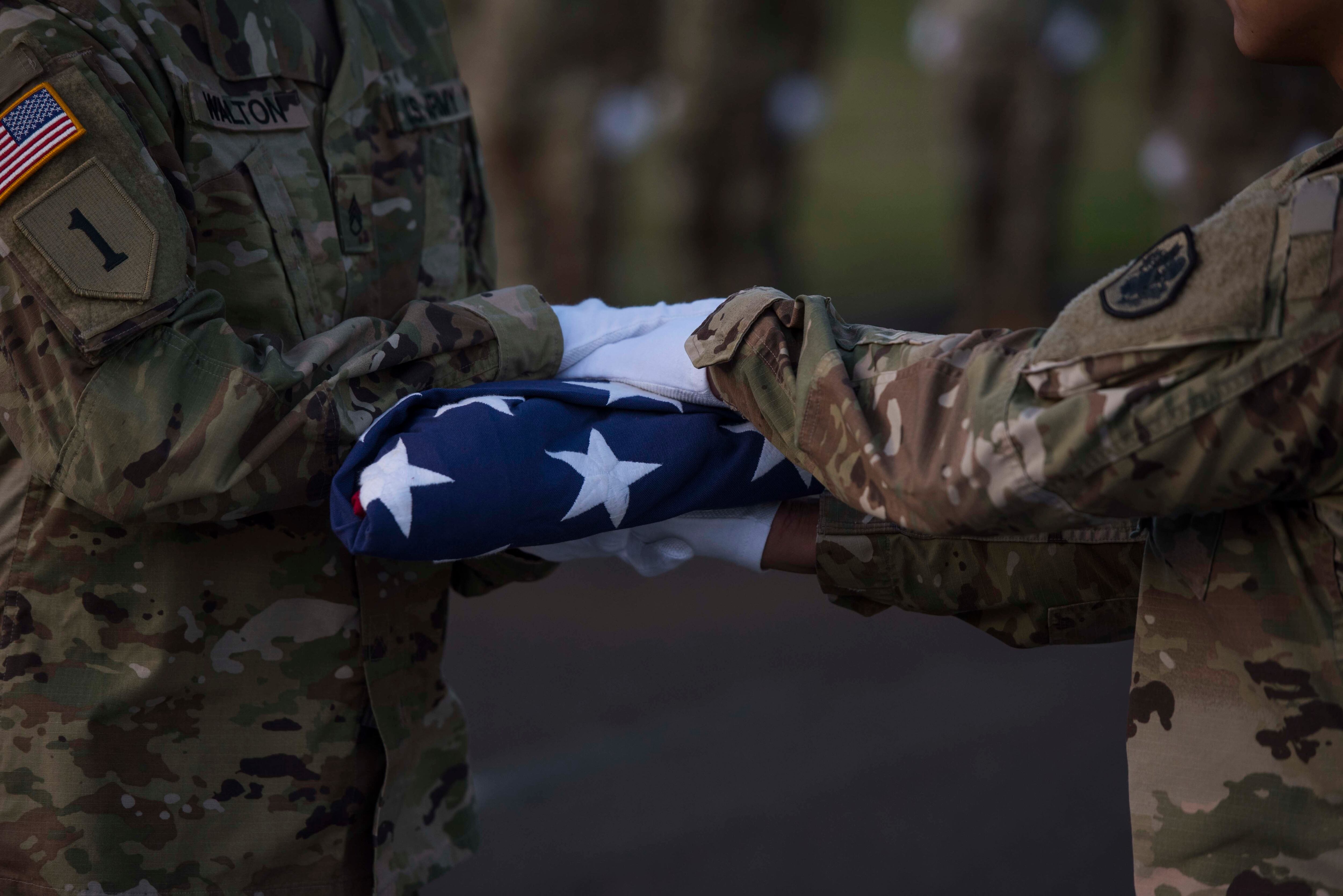 U.S. service members assigned to the Defense POW/MIA Accounting Agency participate in a disinterment ceremony held at the National Memorial Cemetery of the Pacific, Honolulu, Hawaii, Aug. 5, 2019.