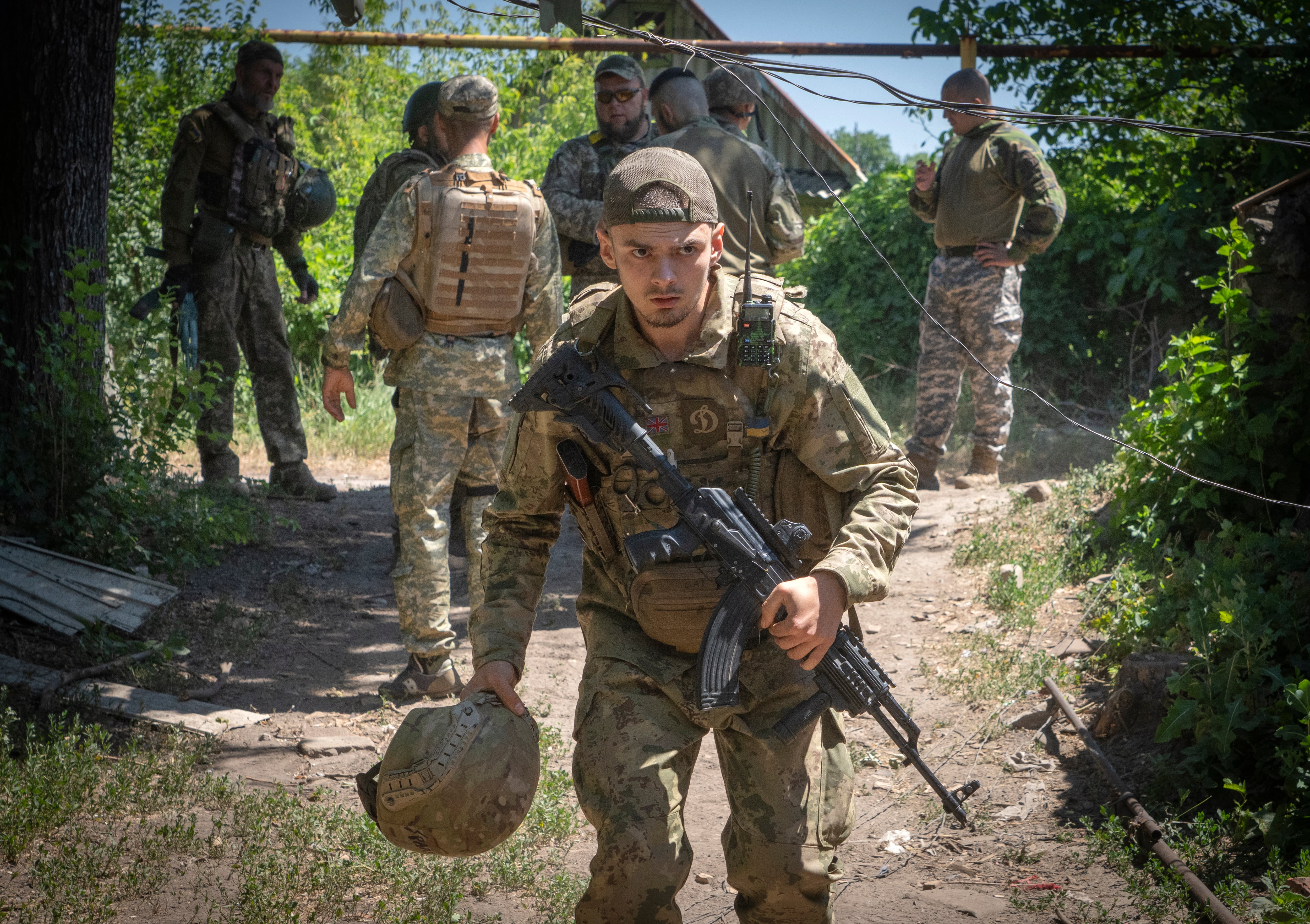 Ukrainian soldiers attend their positions, in the Donetsk region, Ukraine, Saturday, July 2, 2022.