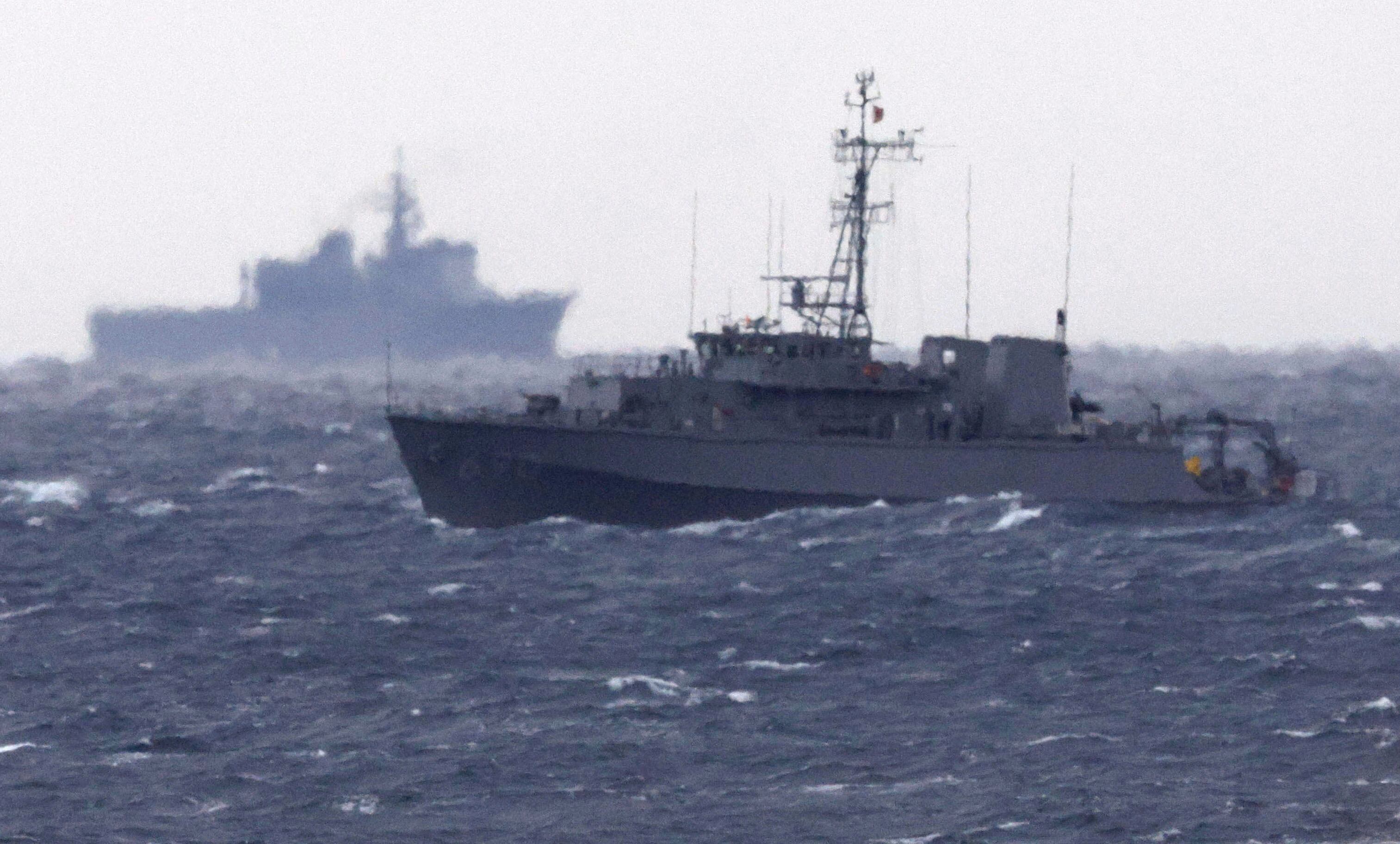 A Japanese Maritime Self Defense Force minesweeper searches in the waters where a U.S. military Osprey aircraft crashed, off Yakushima, Kagoshima prefecture, southern Japan, Friday, Dec. 1, 2023.