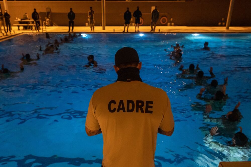 Air Force Special Tactics and Combat Rescue Officer candidates participate in a pool training session while a cadre member evaluates them as part of assessment and selection at Hurlburt Field, Florida, March 24, 2021. STO/CRO selection is an arduous process, which screens candidates to become leaders in the elite Air Force Special Warfare community, leading global access, precision strike and personnel recovery. (Tech. Sgt. Rose Gudex/Air Force)