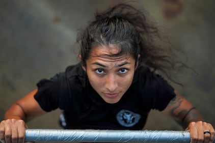 Hospital Corpsman 2nd Class Elizabeth R. Pinon, assigned to the Arleigh Burke-class guided-missile destroyer USS Halsey (DDG 97), exercises topside on Sept. 4, 2020, while in the South China Sea.