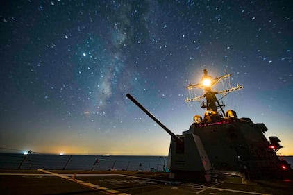 The Arleigh Burke class guided-missile destroyer USS Sterett (DDG 104) steams through the night in the Gulf of Oman on Sept. 17, 2020.