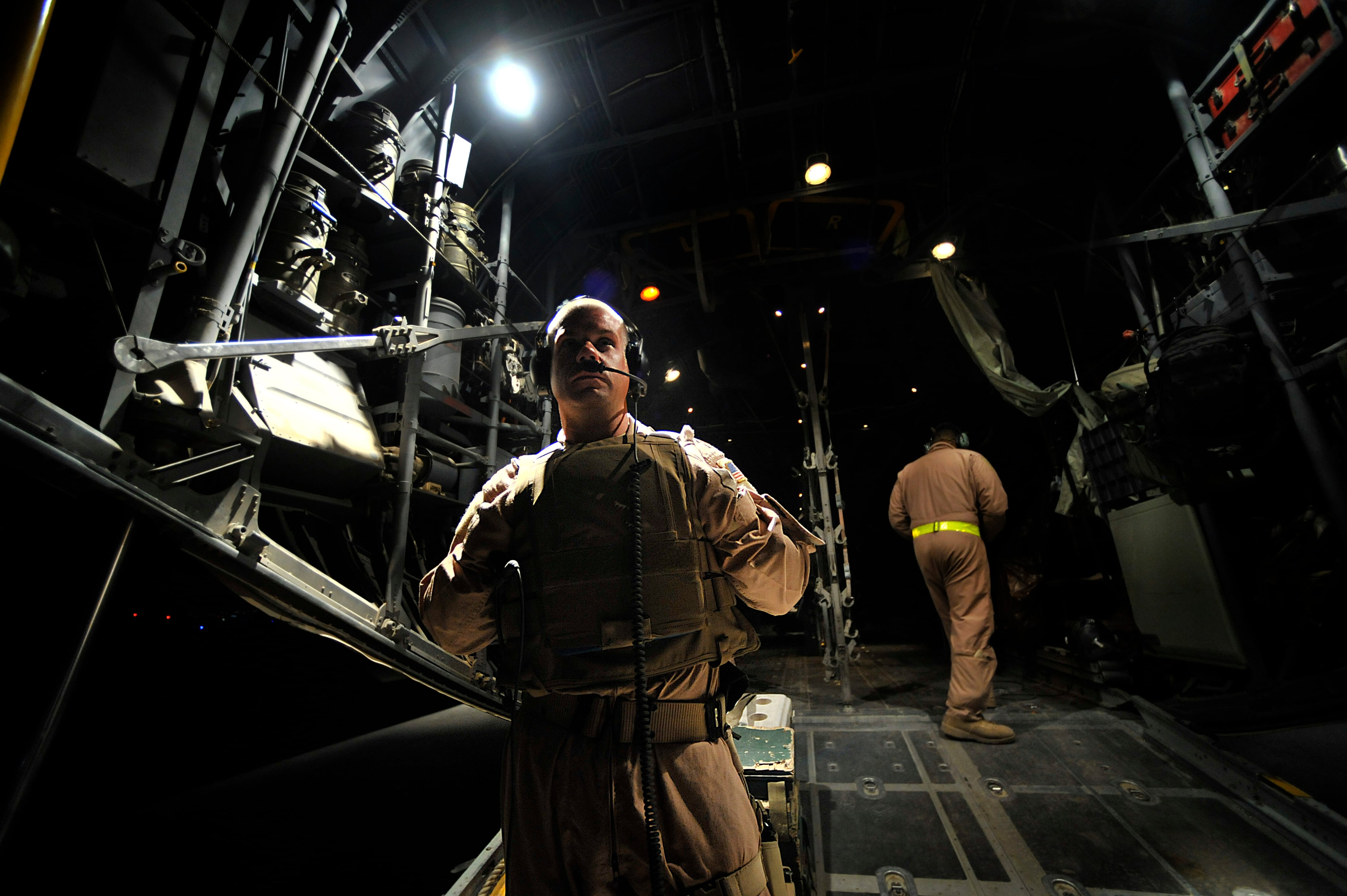 U.S. Air Force Maj. Brandon Bailey, 332nd Expeditionary Operations Support Squadron medical crew director, awaits the arrival of patients from a forward operating base in Mosul, Iraq, on Sept. 23, 2008, during a "Bandage Mission."  Bandage Missions travel to different FOBs throughout Iraq and pick up patients and transport them to the Air Force Theater Hospital in Joint Base Balad, Iraq. (Staff Sgt. Aaron Allmon/Air Force)