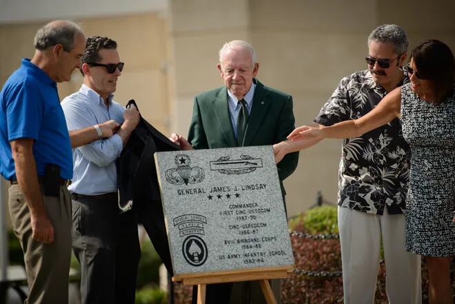 Retired Gen. James Lindsay, center, and family and friends unveil a paver in Lindsay’s honor during the National Airborne Day celebration ceremony Saturday, Aug. 15, 2015, at the Airborne & Special Operations Museum.