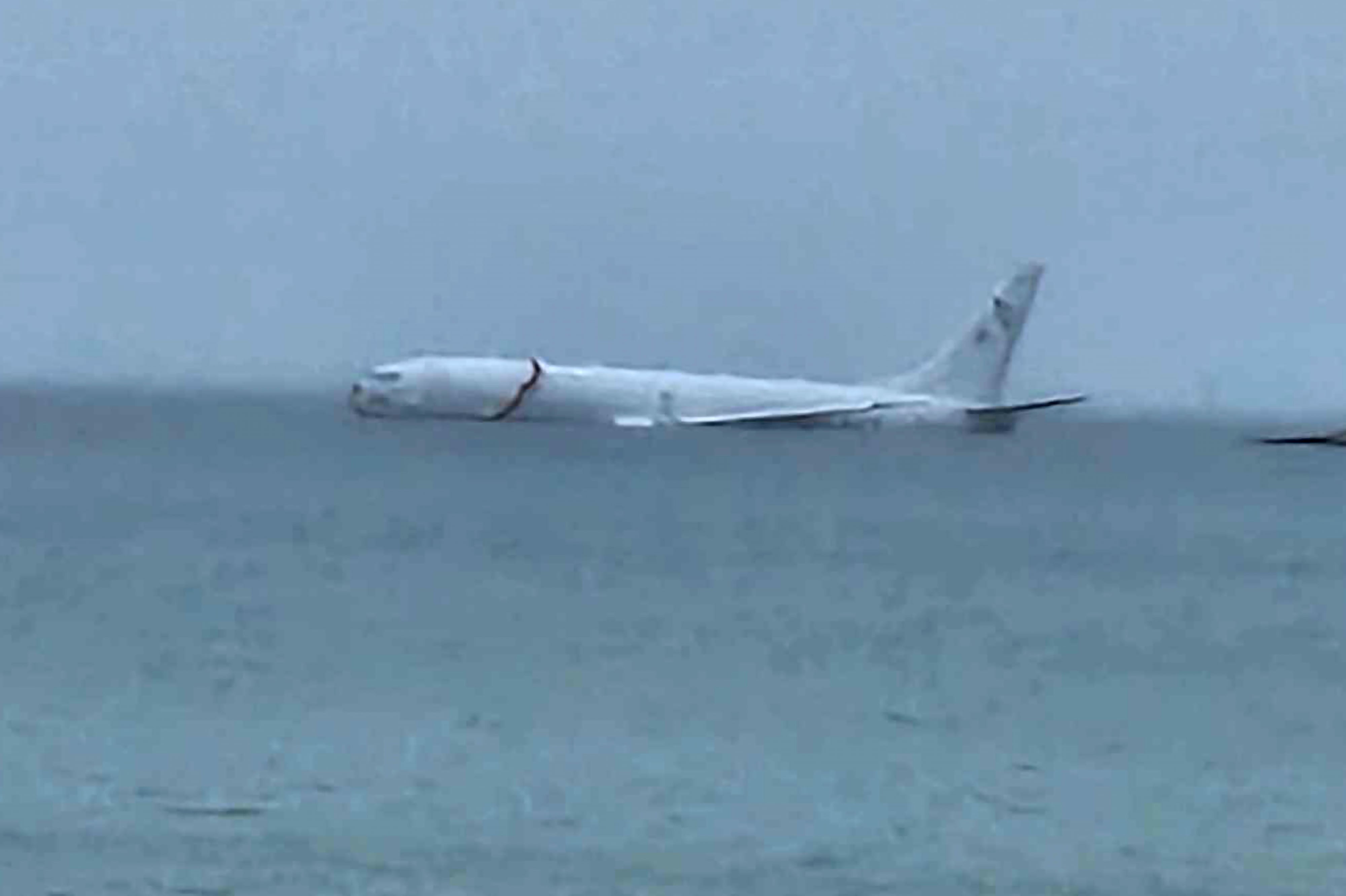 This photo provided by Diane Dircks shows a U.S. Navy plane that overshot a Marine base on Kaneohe Bay, Hawaii, Monday, Nov. 20, 2023.