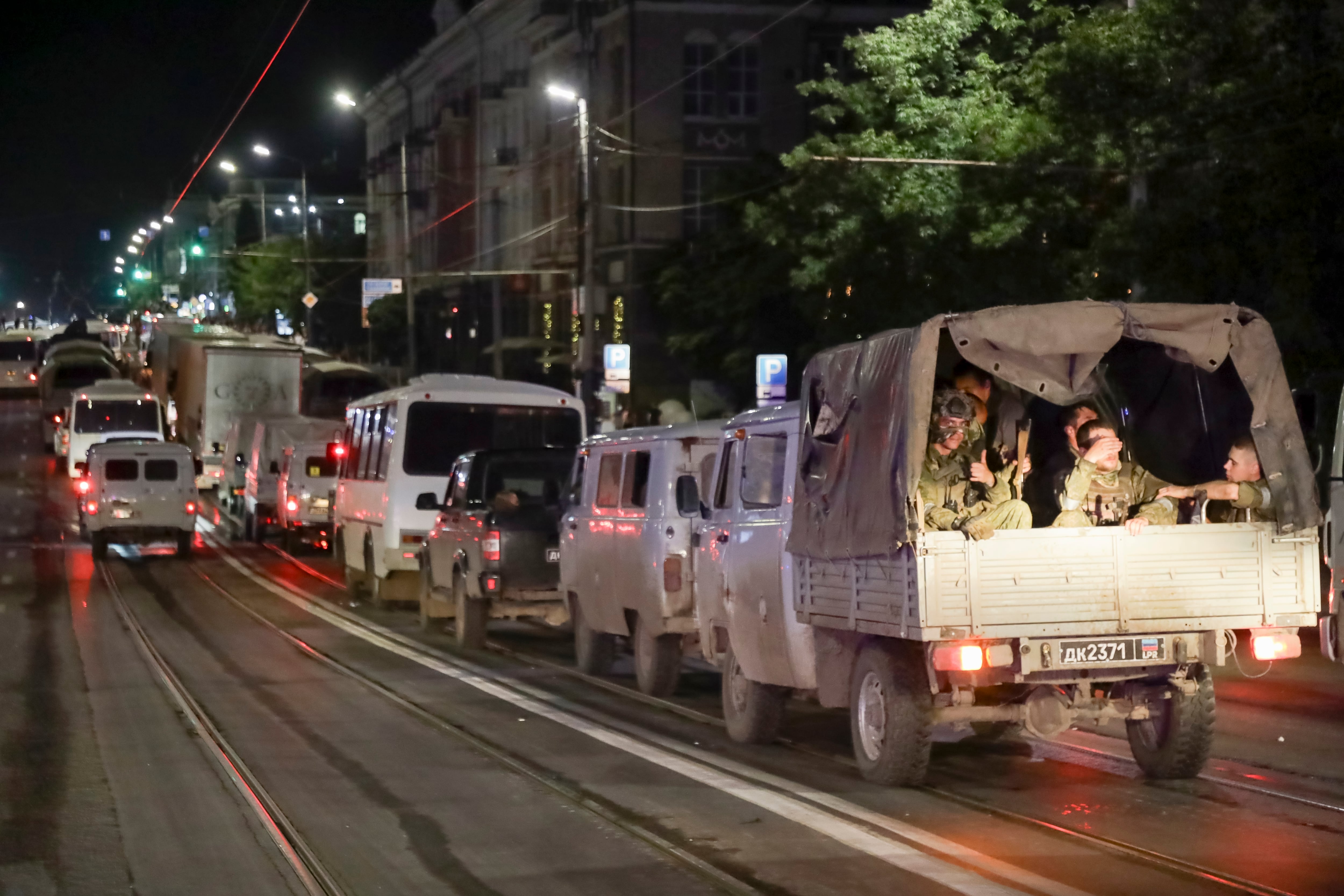 Servicemen of the Wagner Group military company sit in their military vehicles as they prepare to leave an area at the HQ of the Southern Military District in a street in Rostov-on-Don, Russia, Saturday, June 24, 2023.