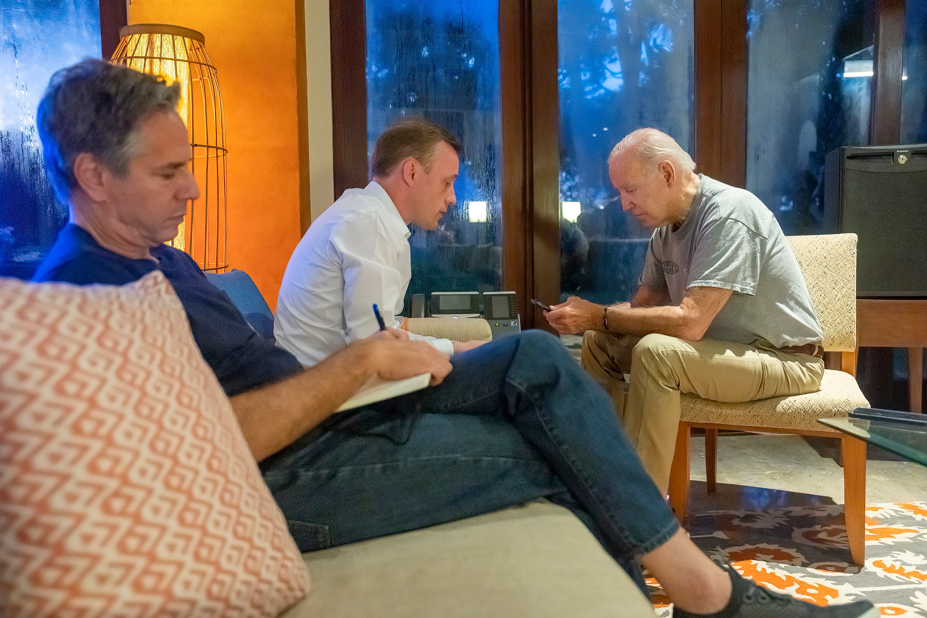 In this photo provided by the White House, President Joe Biden talks on the phone with Polish President Andrzej Duda as White House national security adviser Jake Sullivan, center, and Secretary of State Antony Blinken listen, Wednesday, Nov. 16, 2022, in Nusa Dua, Indonesia.